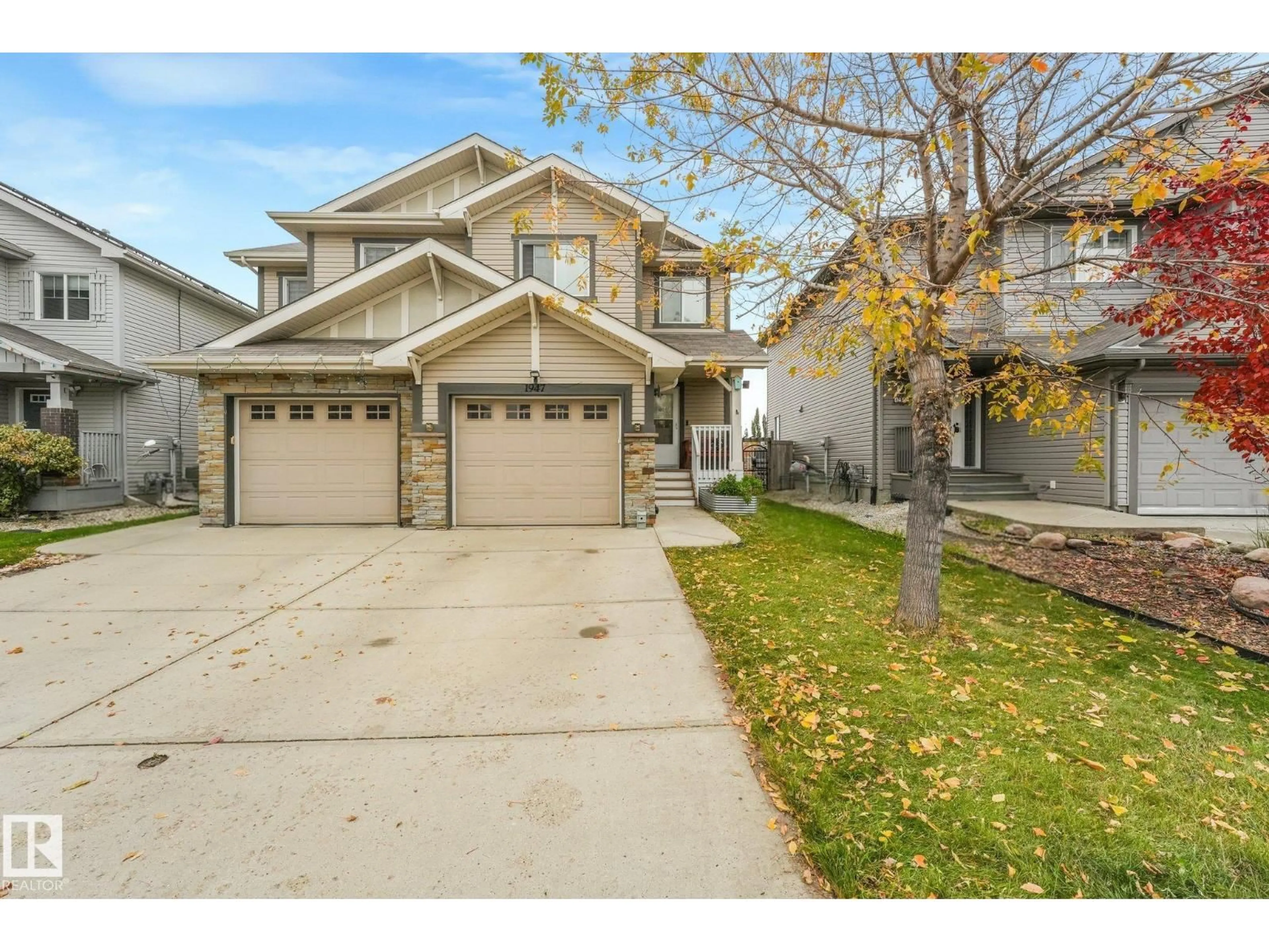 Home with vinyl exterior material, street for 1947 118 ST, Edmonton Alberta T6W2E4