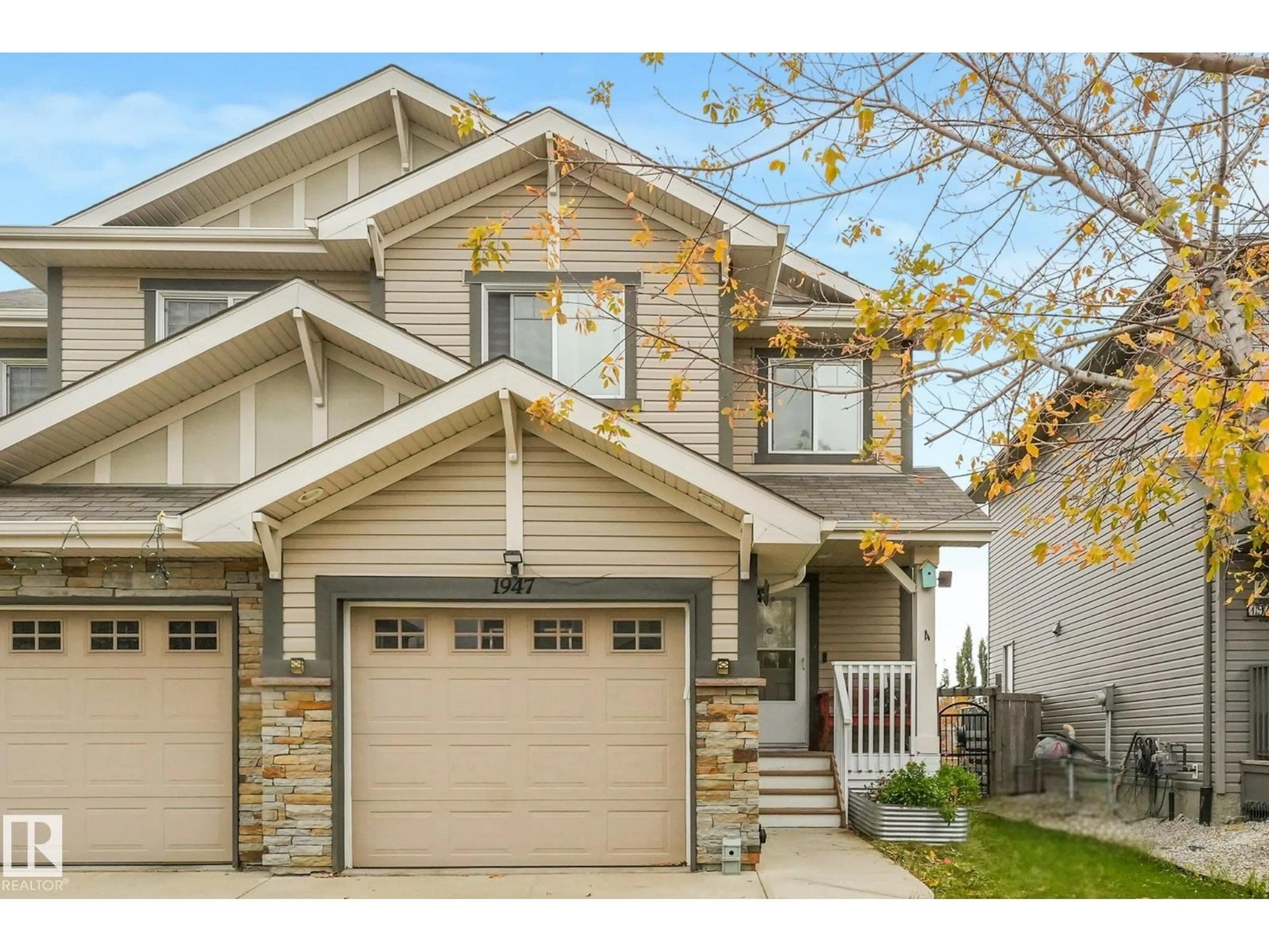 Home with vinyl exterior material, street for 1947 118 ST, Edmonton Alberta T6W2E4