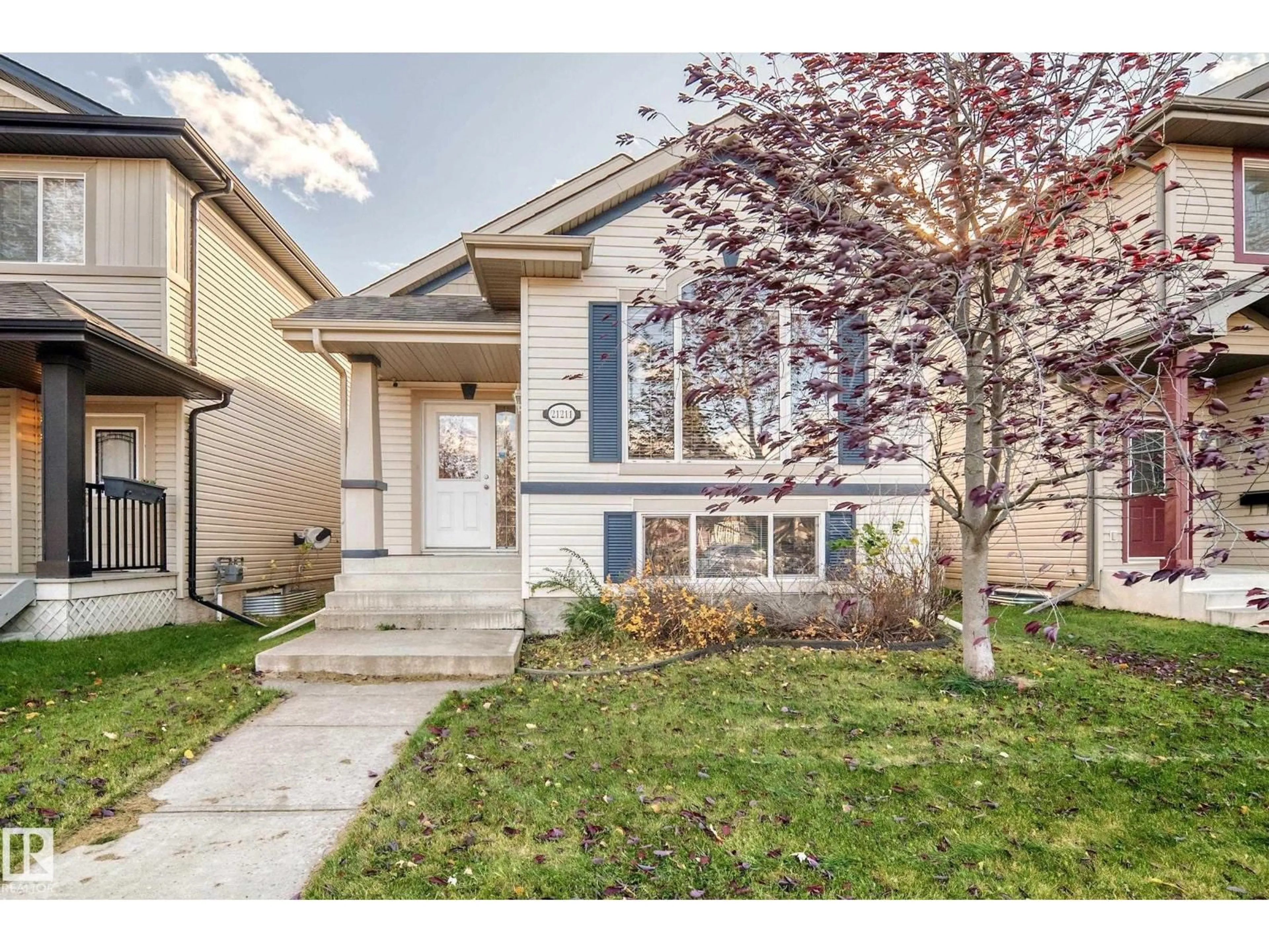 Home with vinyl exterior material, street for 21211 59 AV, Edmonton Alberta T6M0H5