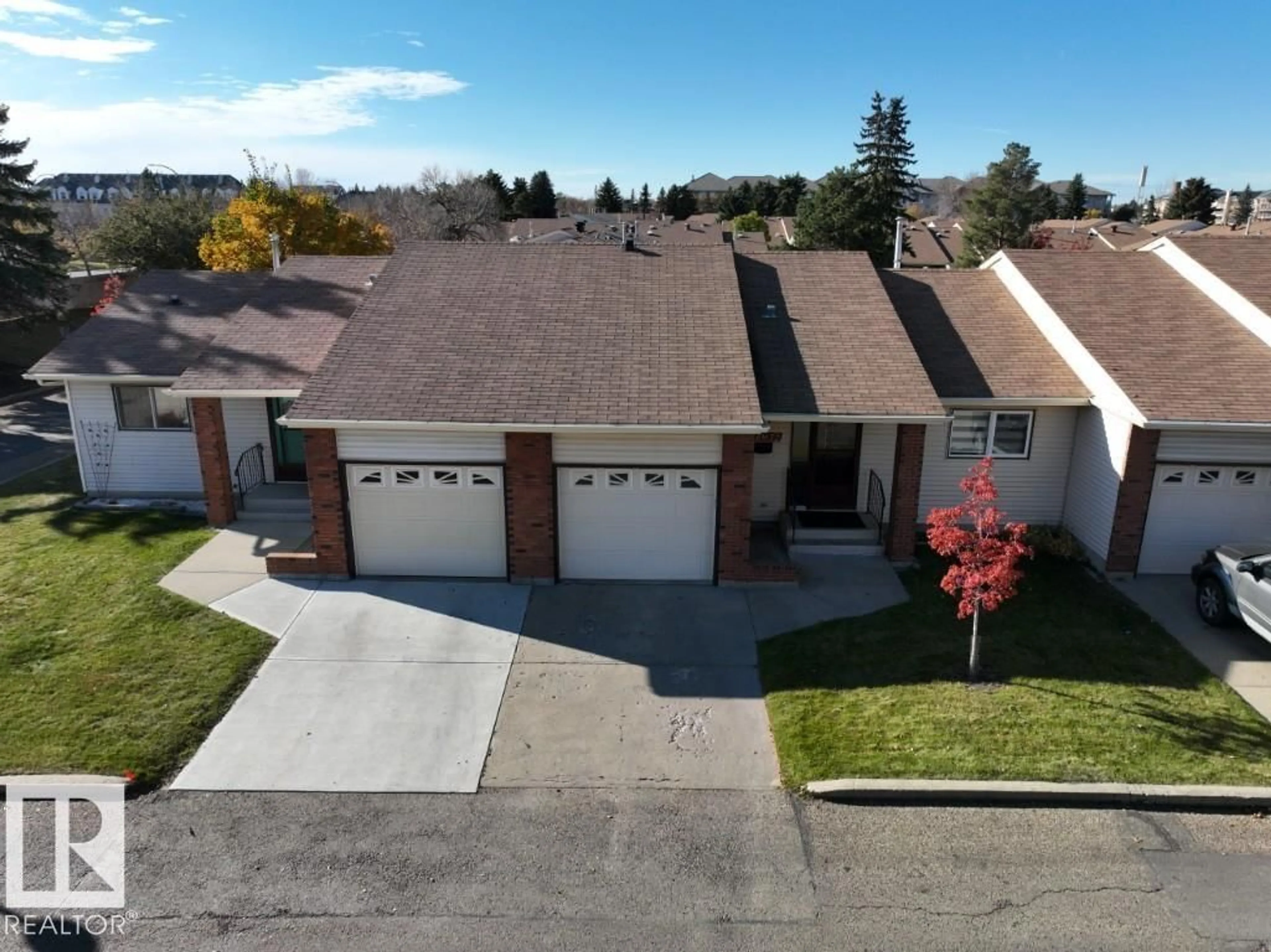 A pic from outside/outdoor area/front of a property/back of a property/a pic from drone, street for 10672 153 AV, Edmonton Alberta T5X5R7