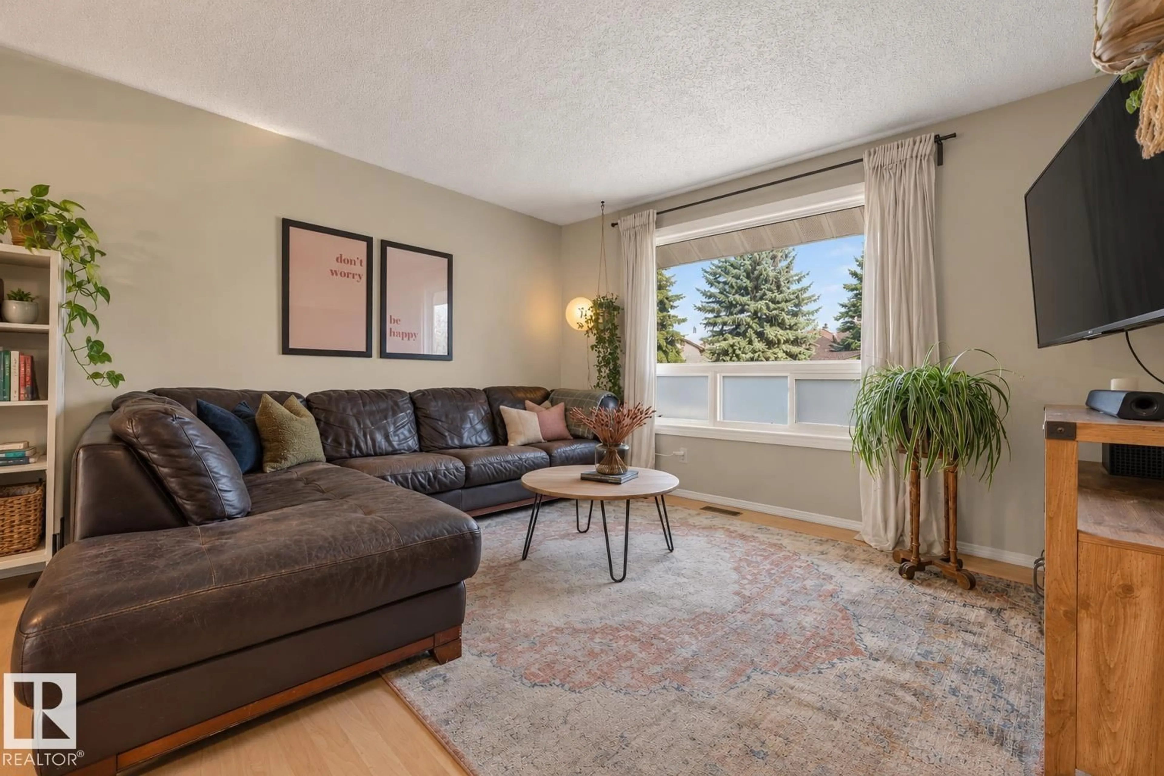 Living room with furniture, unknown for 4709 26 AV, Edmonton Alberta T6L4W4