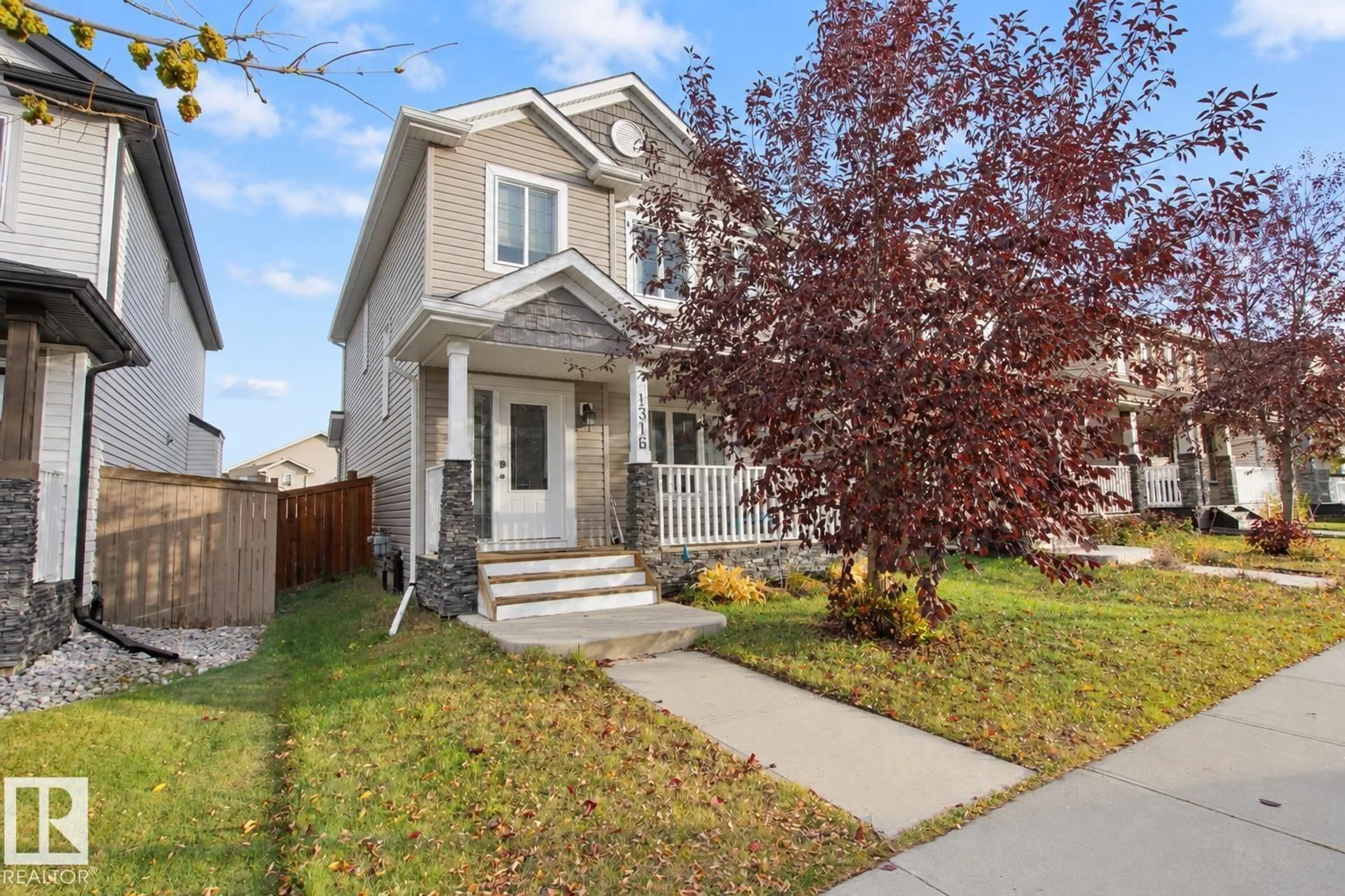 Home with vinyl exterior material, street for 1316 29 AV, Edmonton Alberta T6T0V7