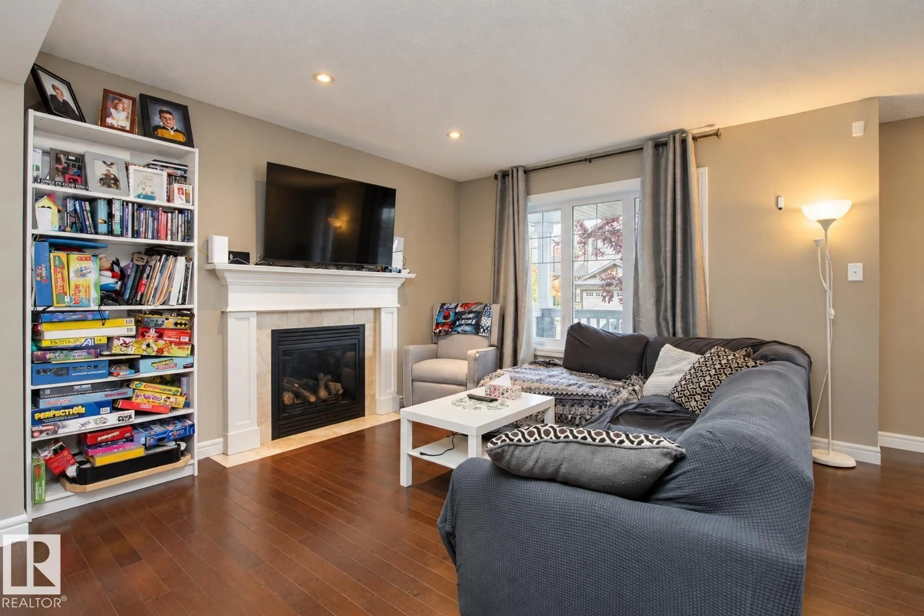 Living room with furniture, wood/laminate floor for 1316 29 AV, Edmonton Alberta T6T0V7