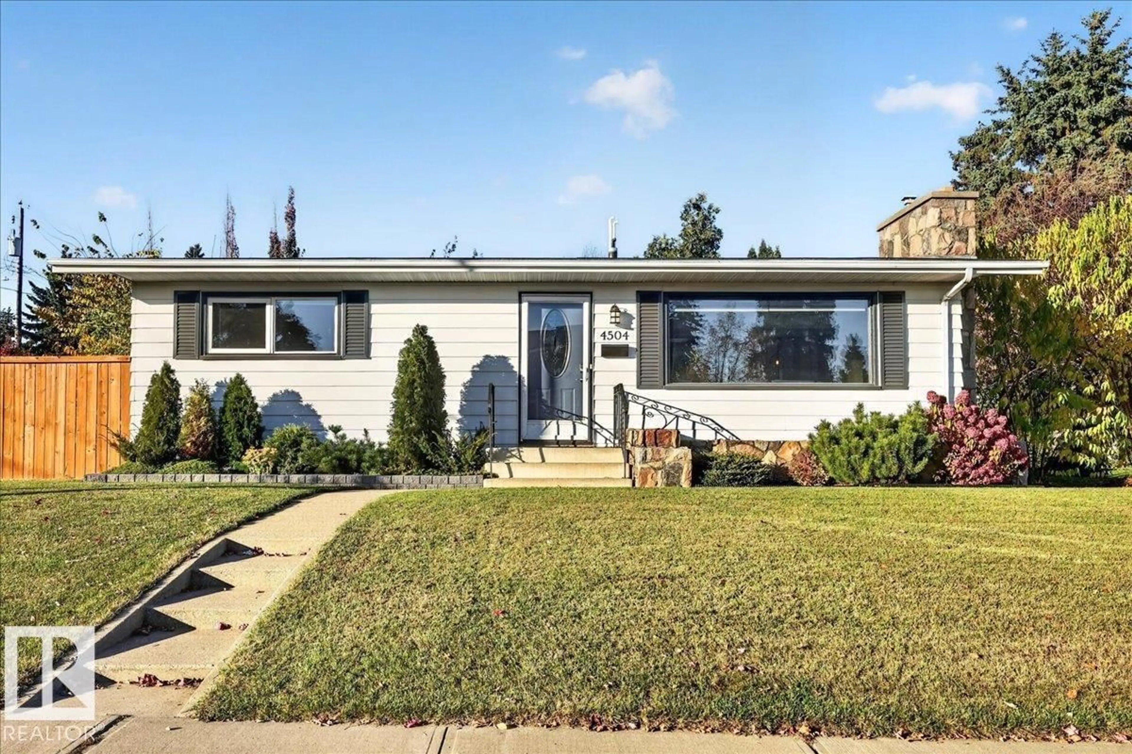 Home with vinyl exterior material, street for 4504 105A AV, Edmonton Alberta T6A1B9