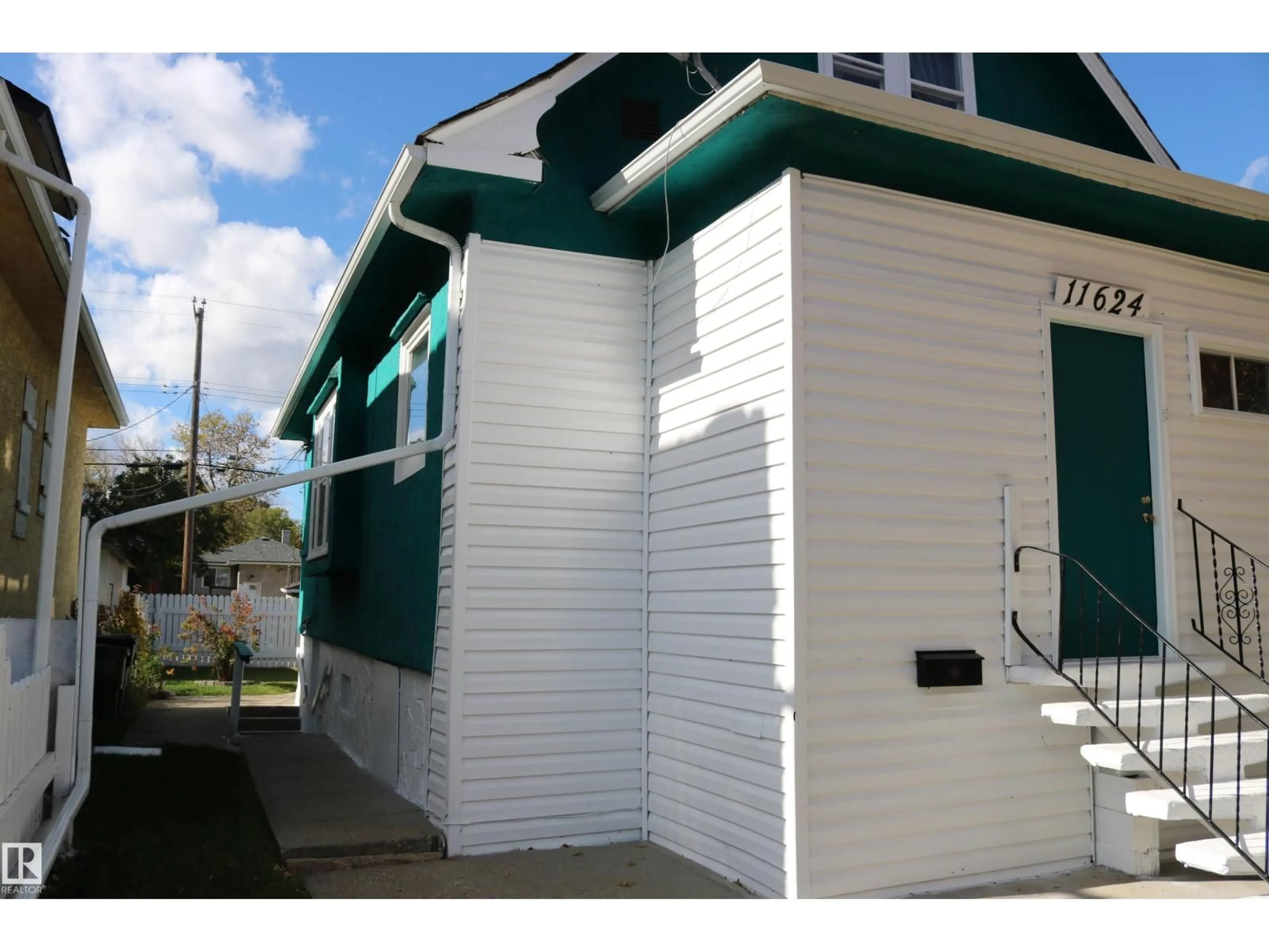 Home with vinyl exterior material, street for NW - 11624 82 ST, Edmonton Alberta T5B1P8