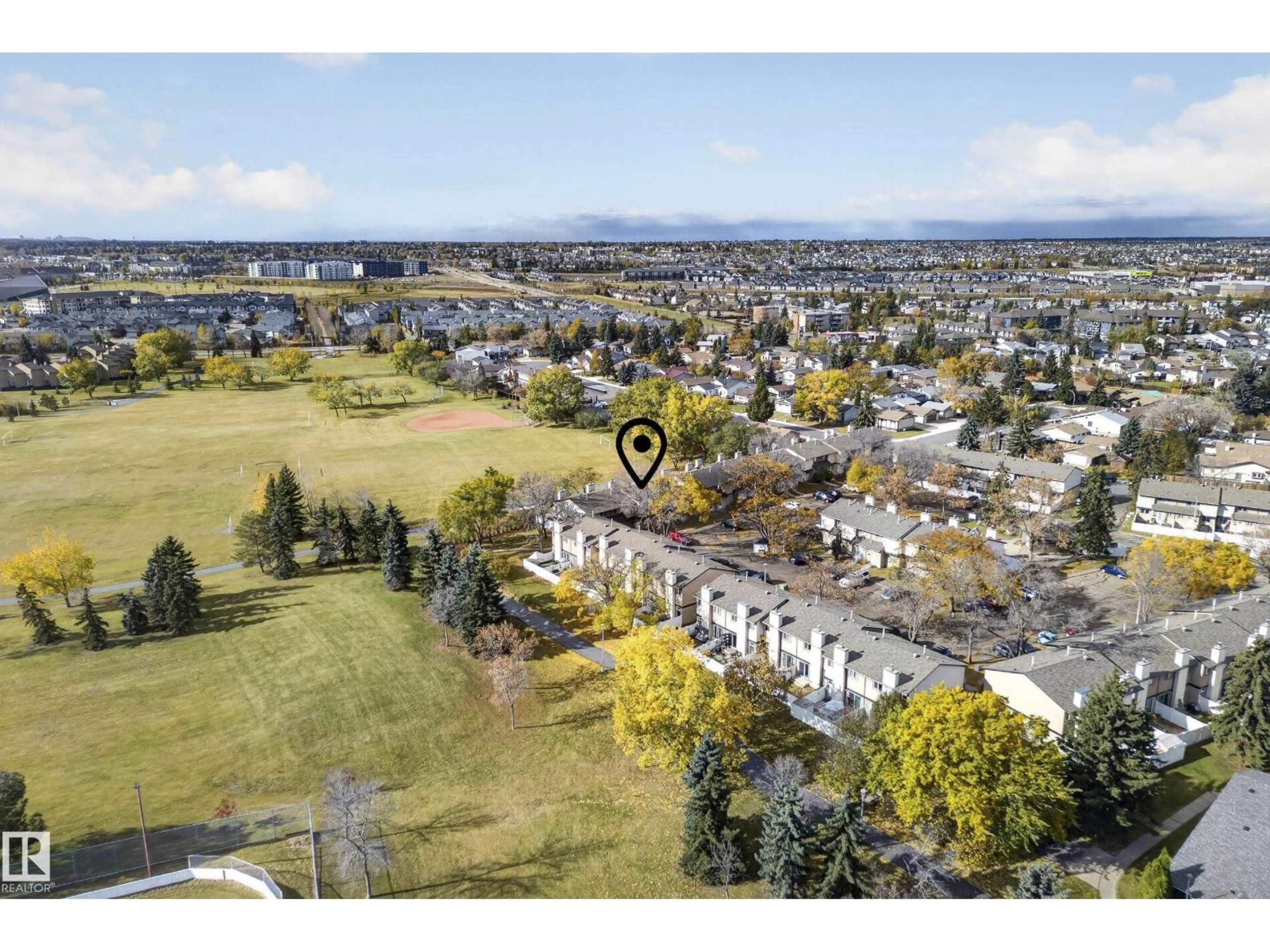 A pic from outside/outdoor area/front of a property/back of a property/a pic from drone, mountain view for 3257 142 AV, Edmonton Alberta T5Y1H9