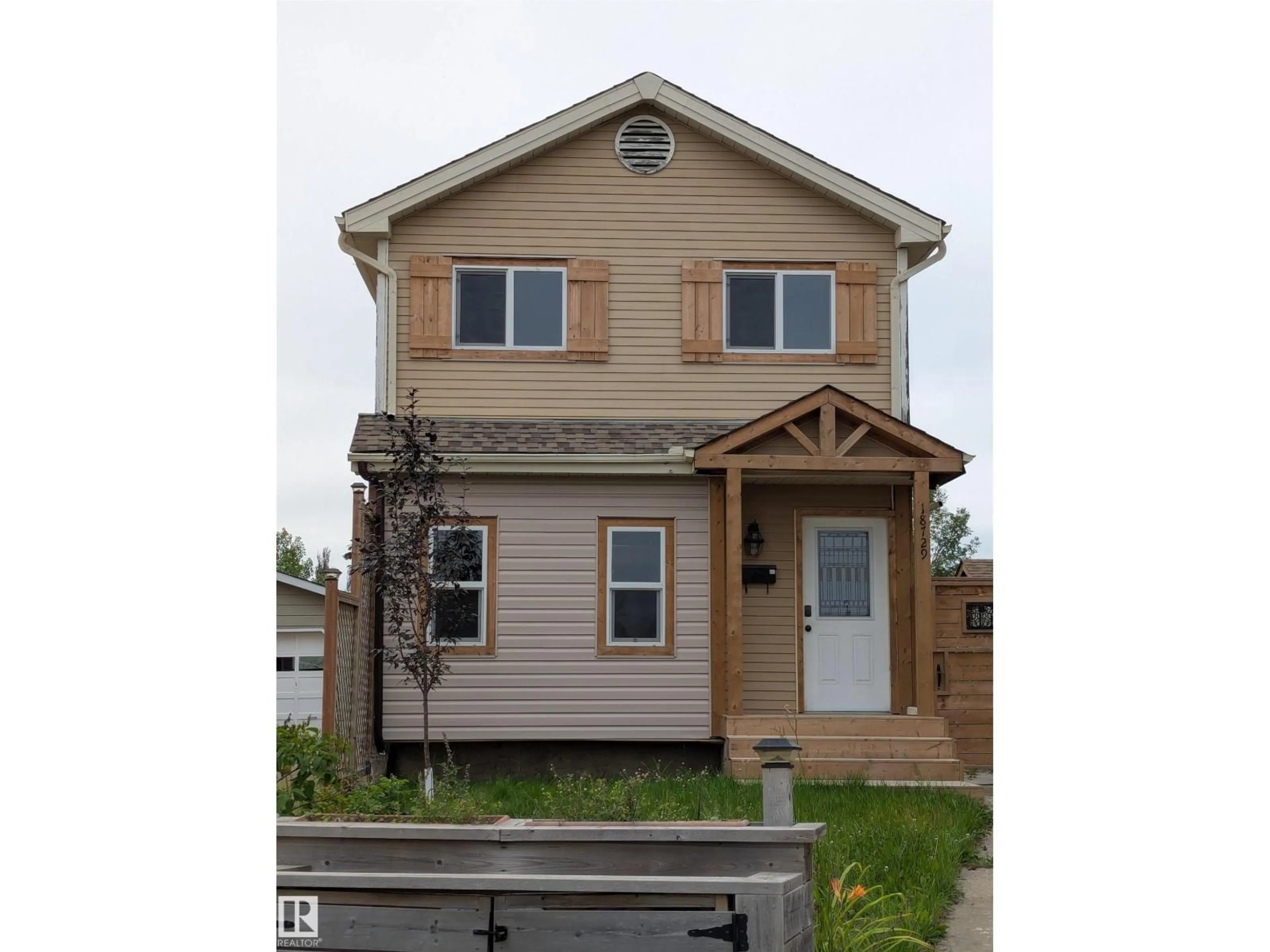 Home with vinyl exterior material, street for 18729 95A AV NW, Edmonton Alberta T5T3W4