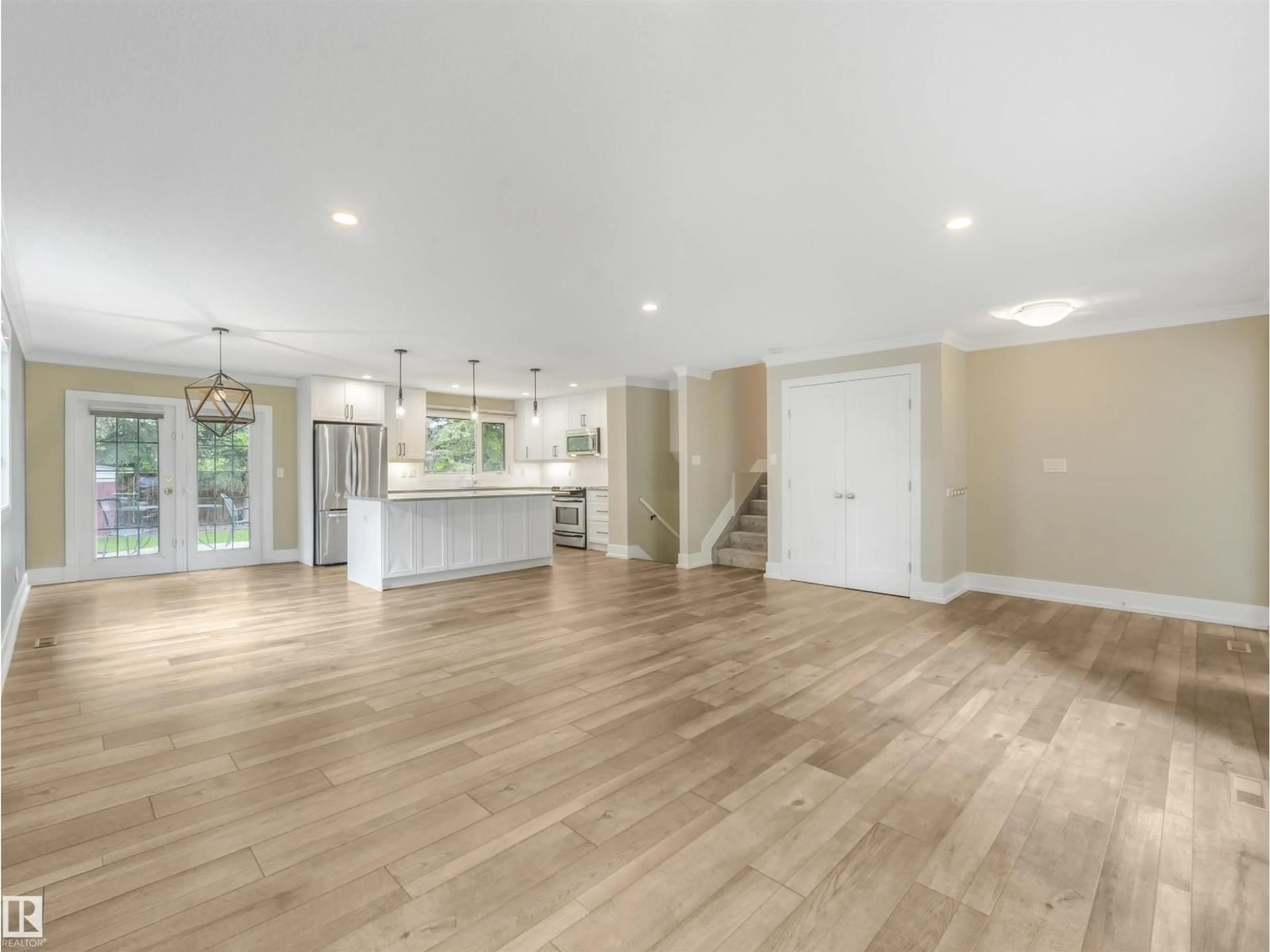 Open concept kitchen, wood/laminate floor for 5708 144 ST, Edmonton Alberta T6H4H4