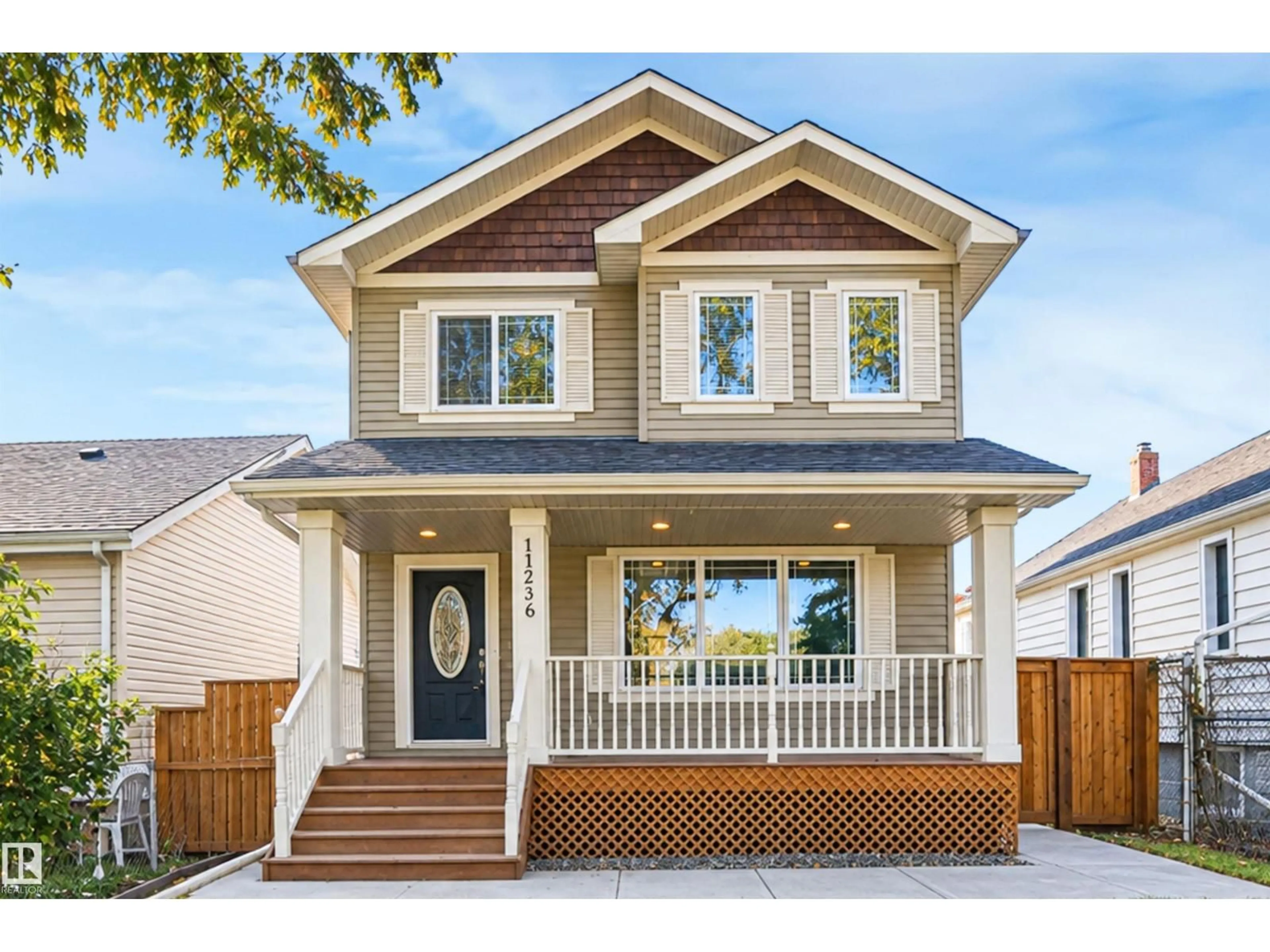 Home with vinyl exterior material, street for 11236 89 ST, Edmonton Alberta T5B3T4