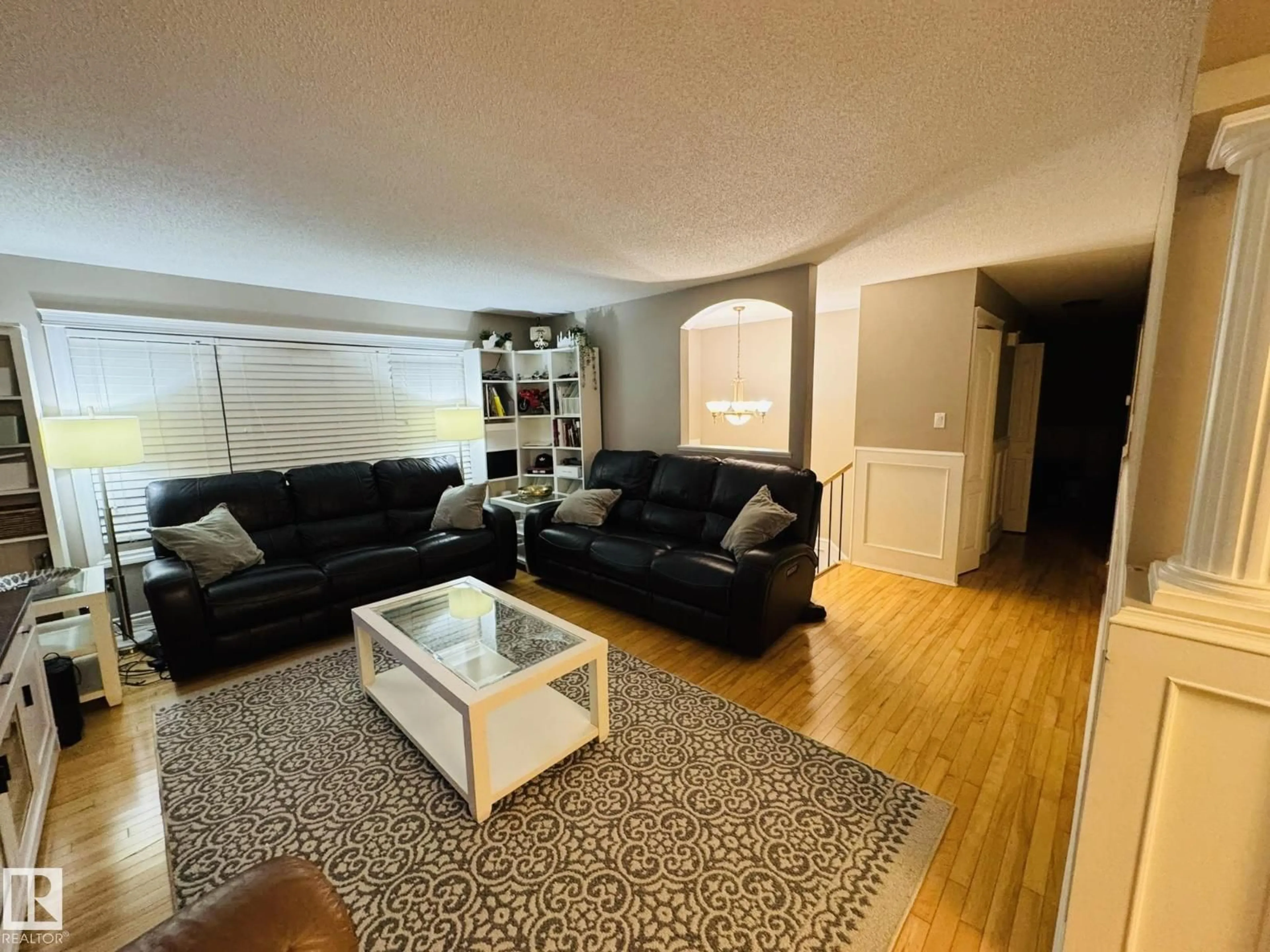 Living room with furniture, unknown for 8416 145 AV, Edmonton Alberta T5E2J2