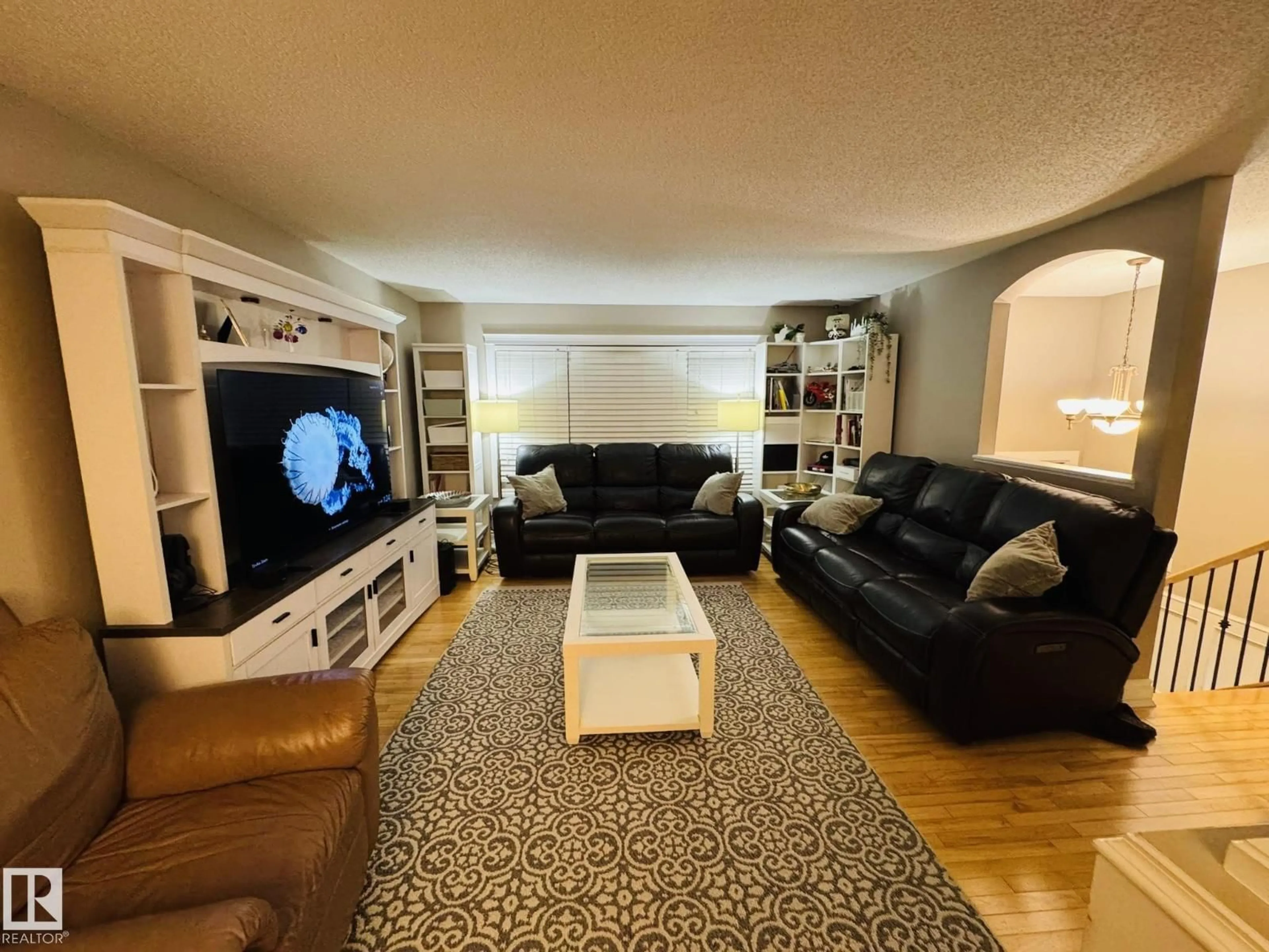 Living room with furniture, unknown for 8416 145 AV, Edmonton Alberta T5E2J2