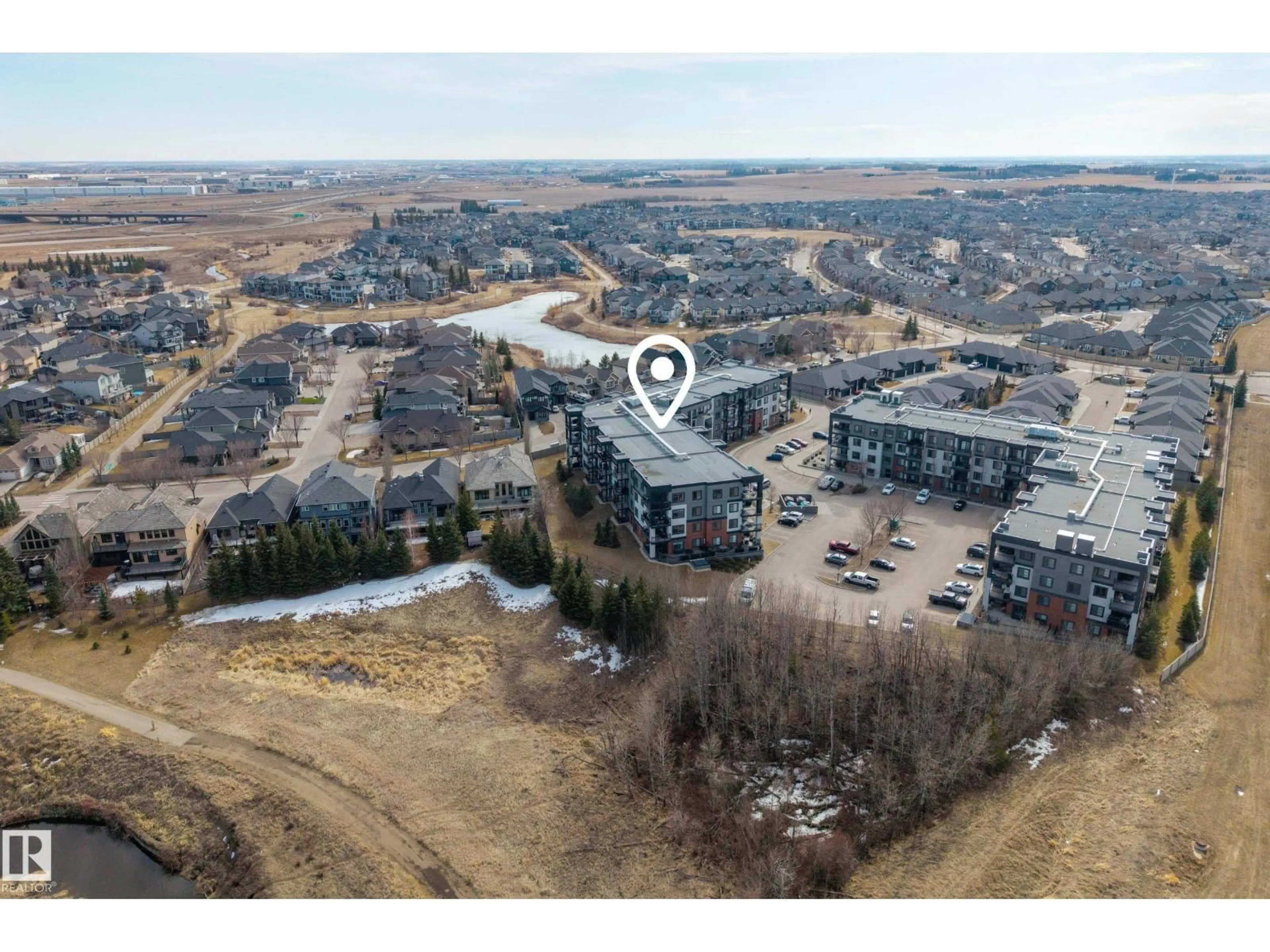 A pic from outside/outdoor area/front of a property/back of a property/a pic from drone, water/lake/river/ocean view for #127 - 1154 ADAMSON DR, Edmonton Alberta T6W3N5