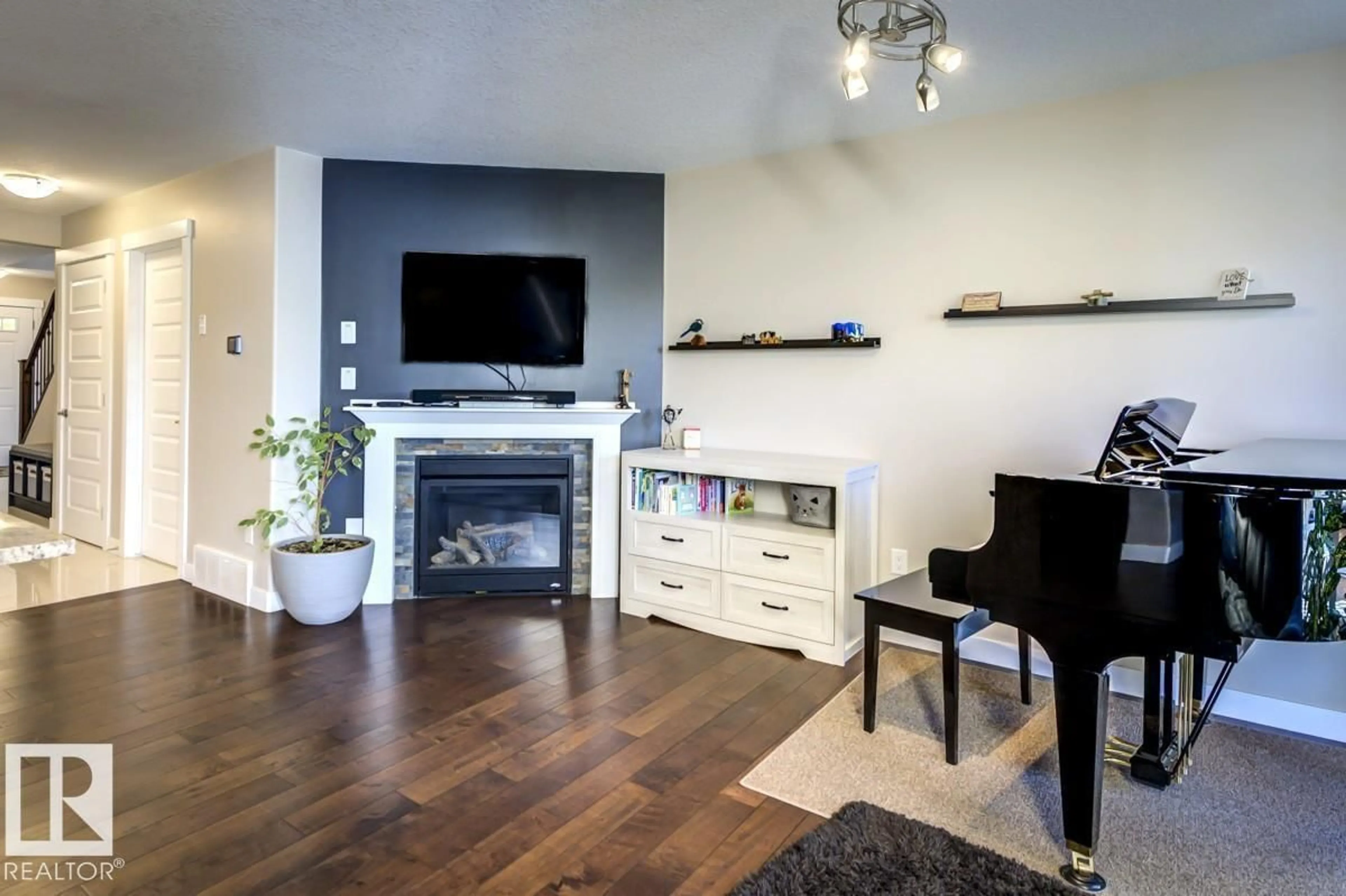 Living room with furniture, wood/laminate floor for 126 RADCLIFFE WD, Fort Saskatchewan Alberta T8L0M6