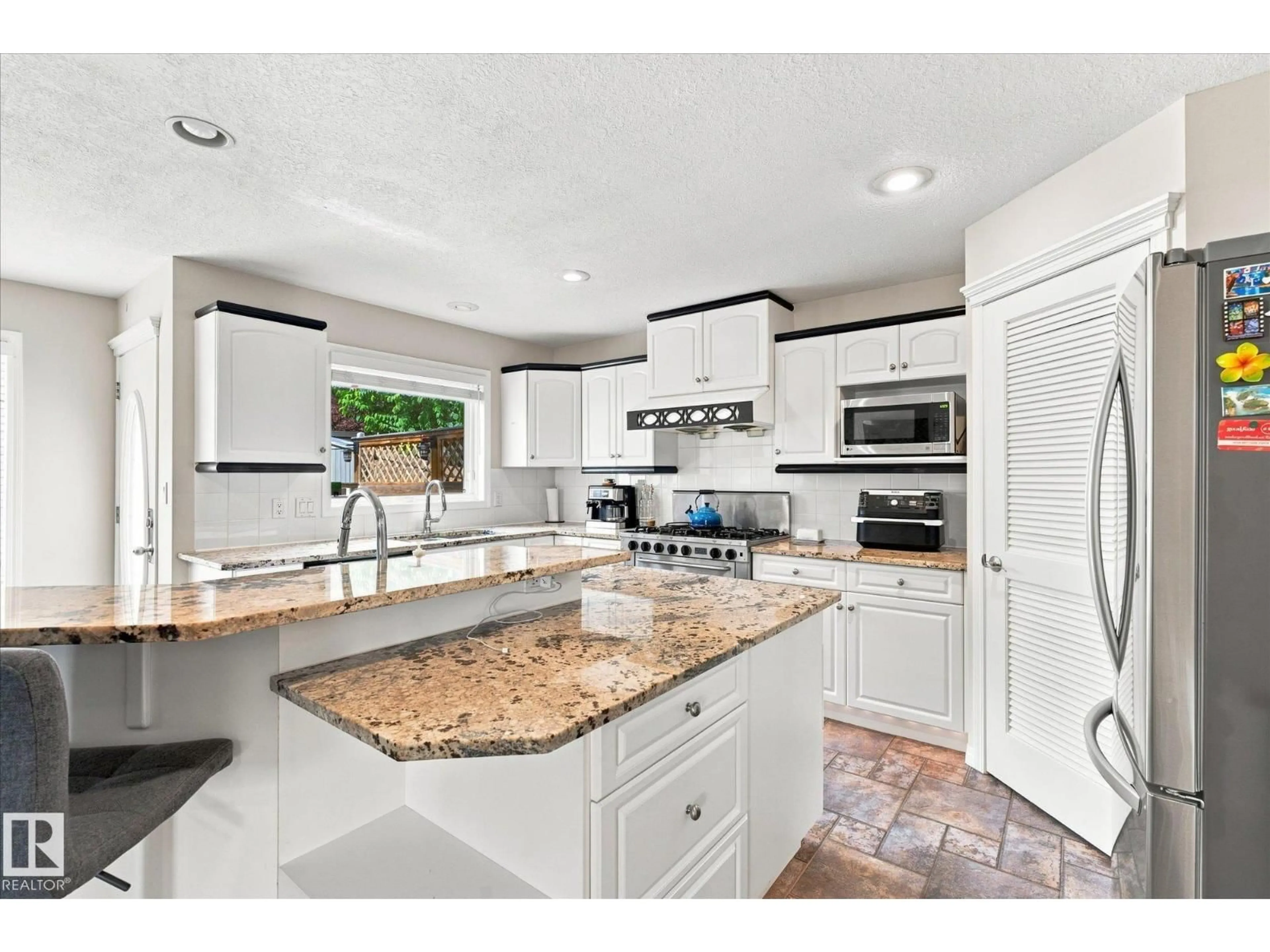 Open concept kitchen, ceramic/tile floor for NW - 1312 116 ST, Edmonton Alberta T6J7B3