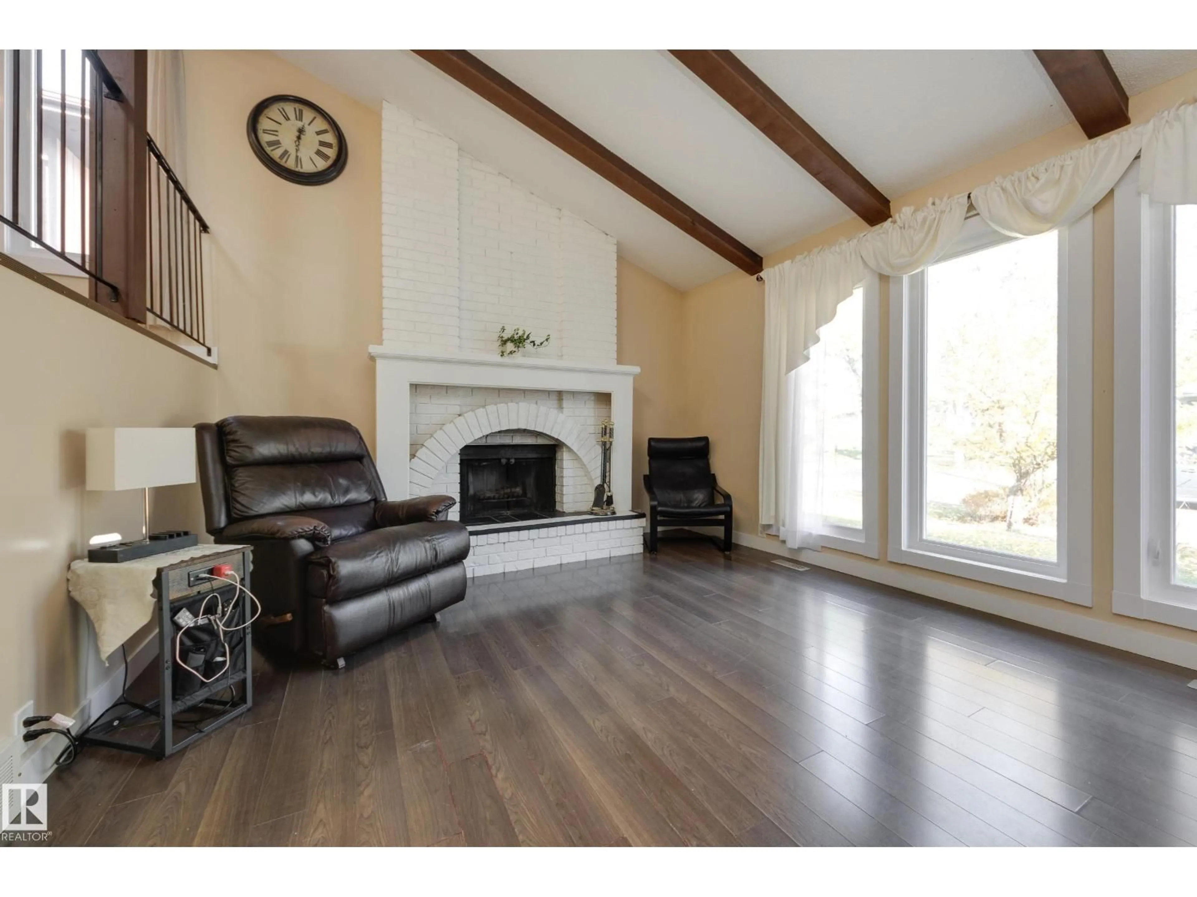 Living room with furniture, wood/laminate floor for 1 ANITA CR, St. Albert Alberta T8N2W3