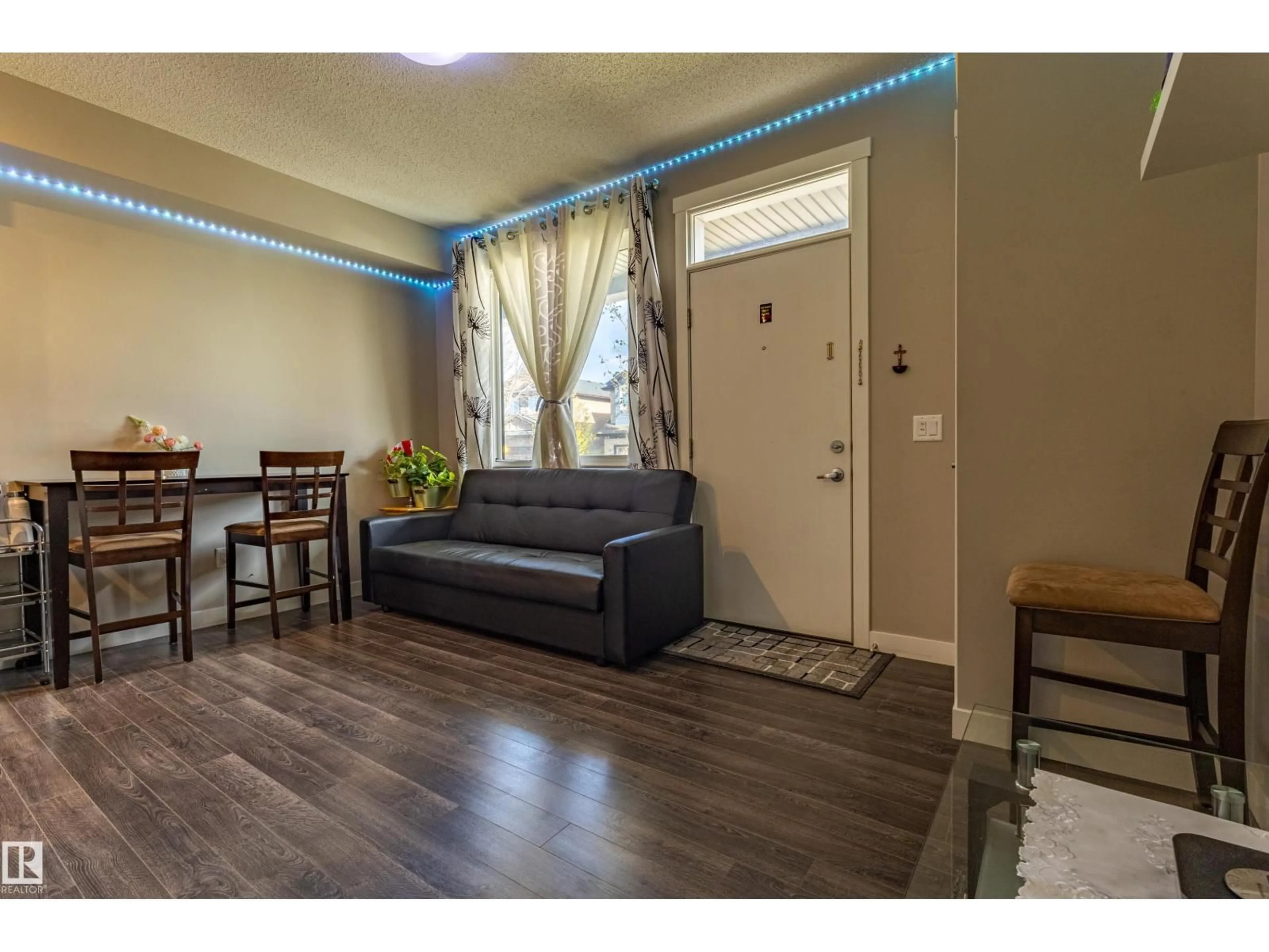 Living room with furniture, wood/laminate floor for 456 ALLARD BV, Edmonton Alberta T6W3S7