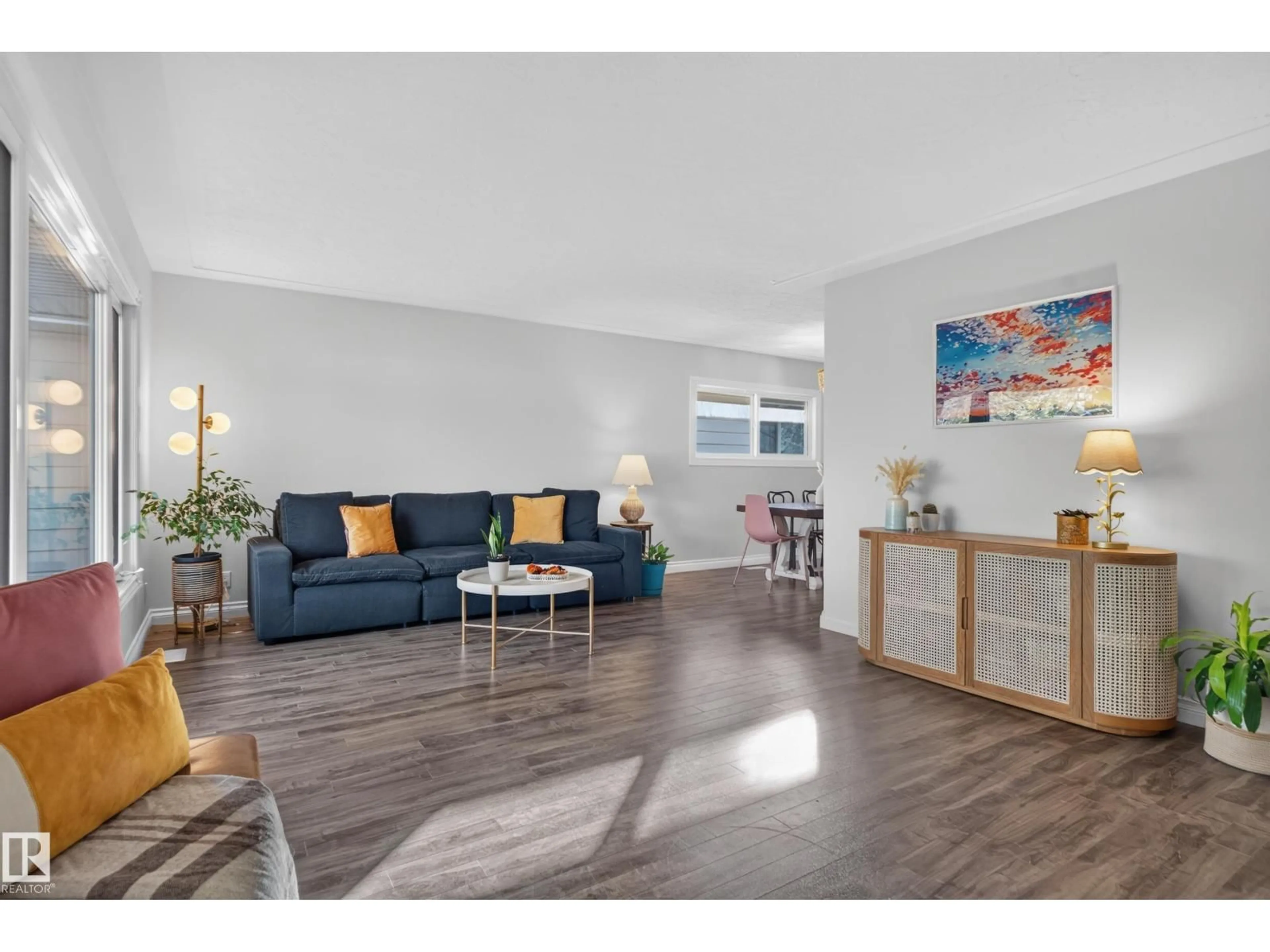 Living room with furniture, wood/laminate floor for 9814 79 ST, Edmonton Alberta T6A3G1