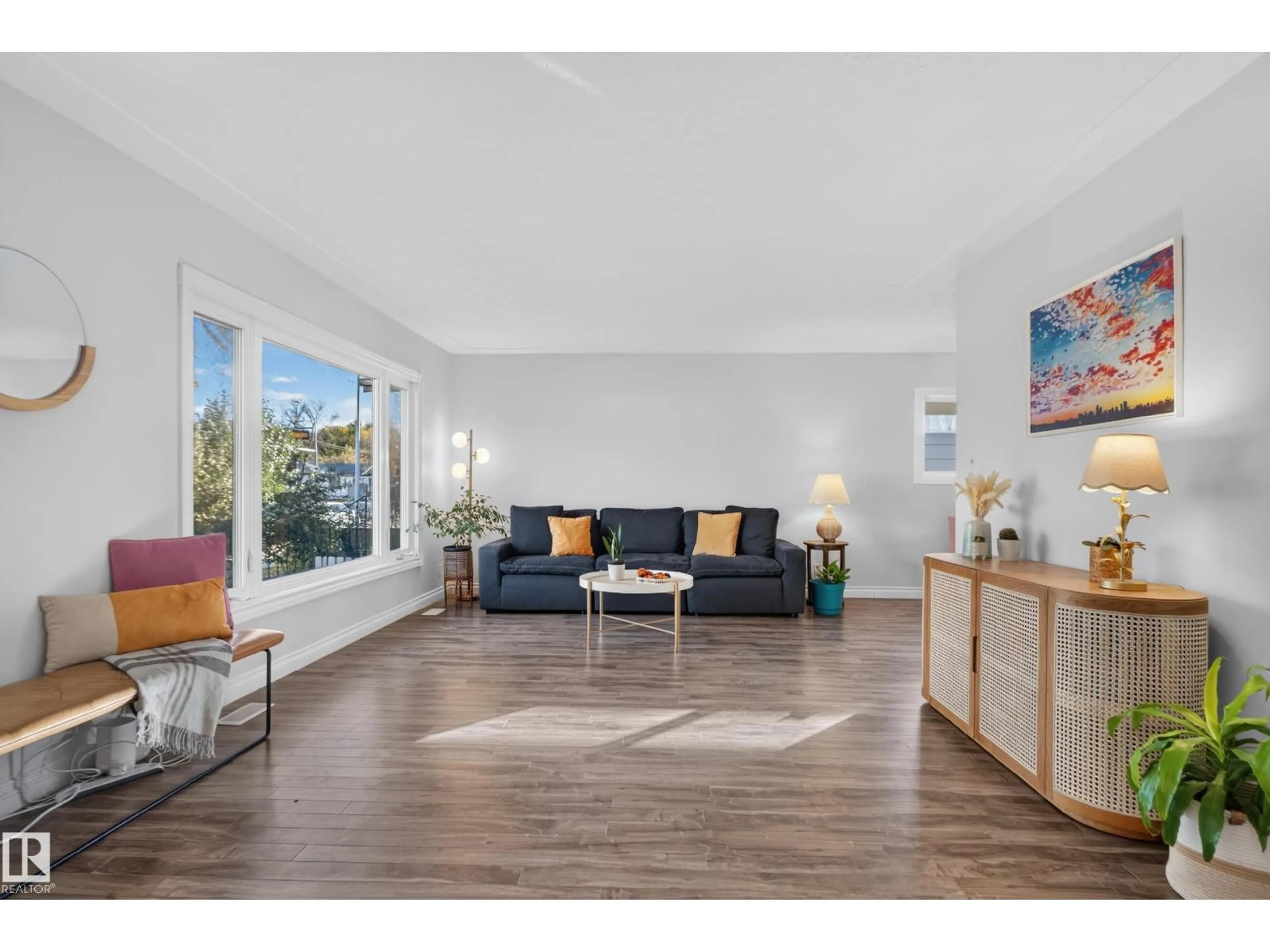 Living room with furniture, wood/laminate floor for 9814 79 ST, Edmonton Alberta T6A3G1