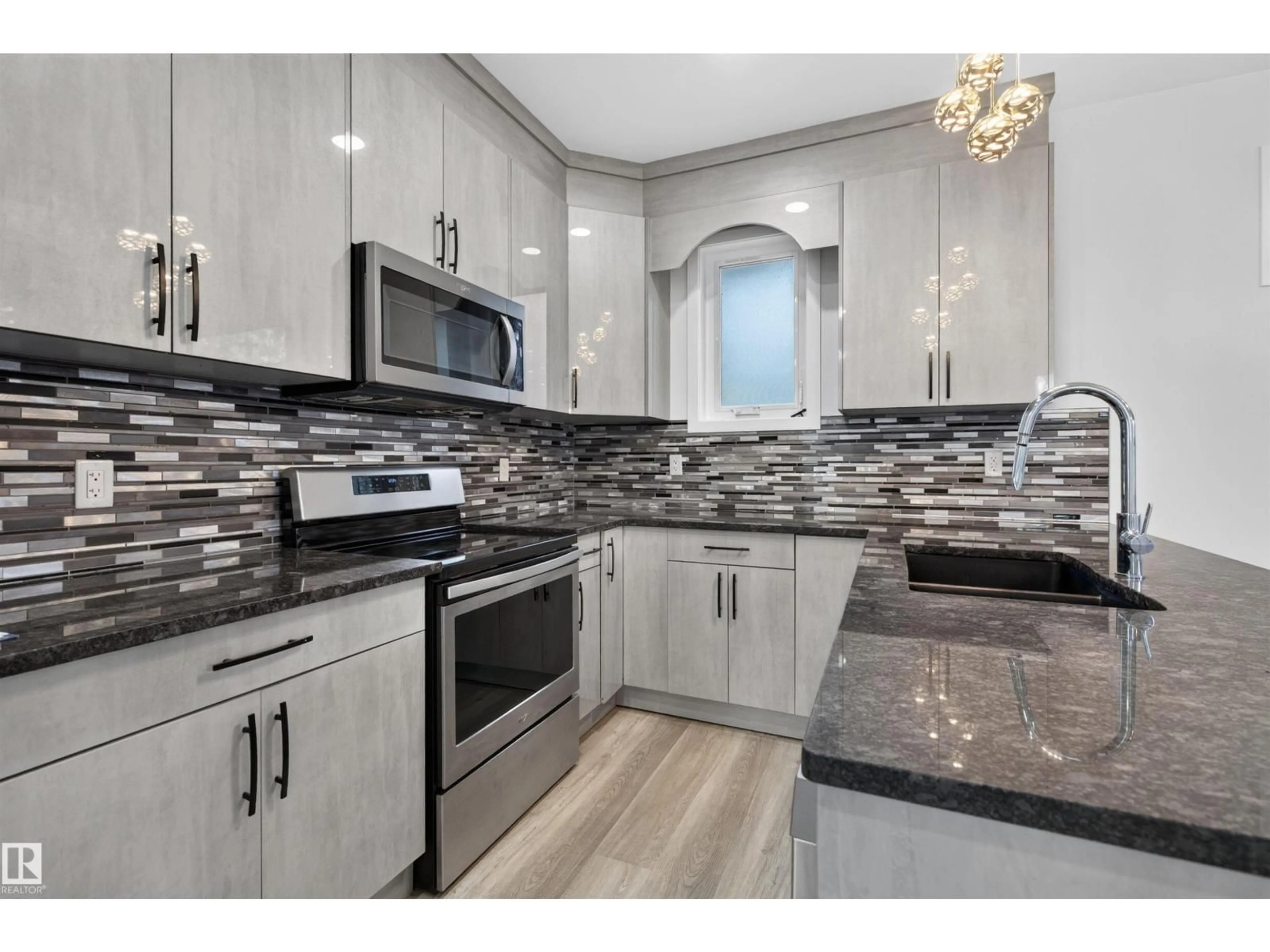Open concept kitchen, ceramic/tile floor for 9314 107A AV, Edmonton Alberta T5H0Z3