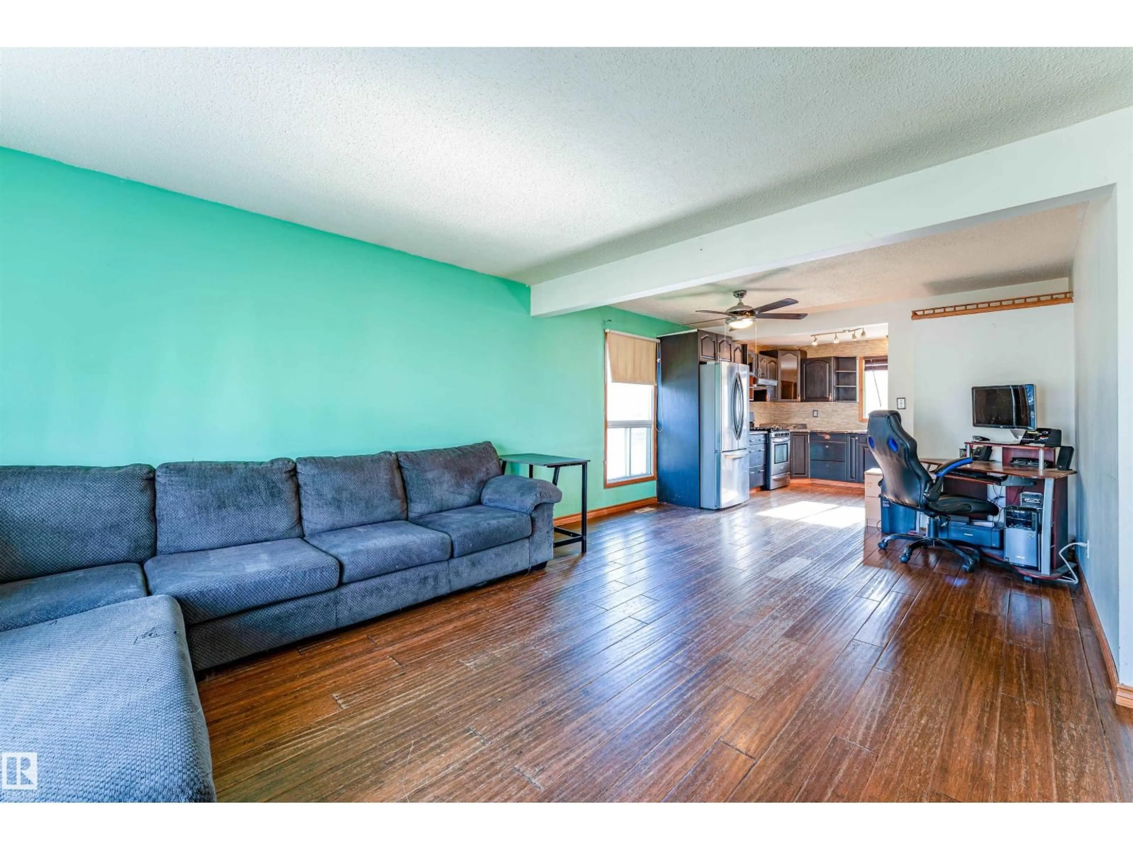 Living room with furniture, wood/laminate floor for 113 GREENWOOD DR, Spruce Grove Alberta T7X1X8