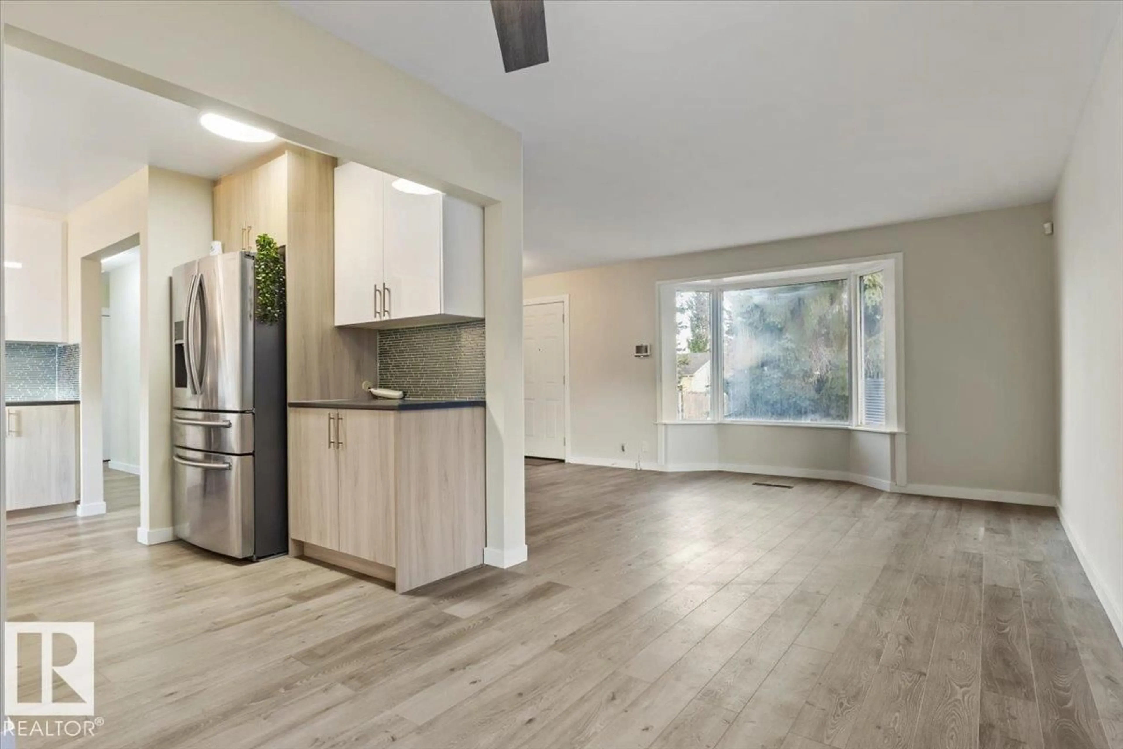 Open concept kitchen, wood/laminate floor for NW - 10522 163 ST, Edmonton Alberta T5P3P1