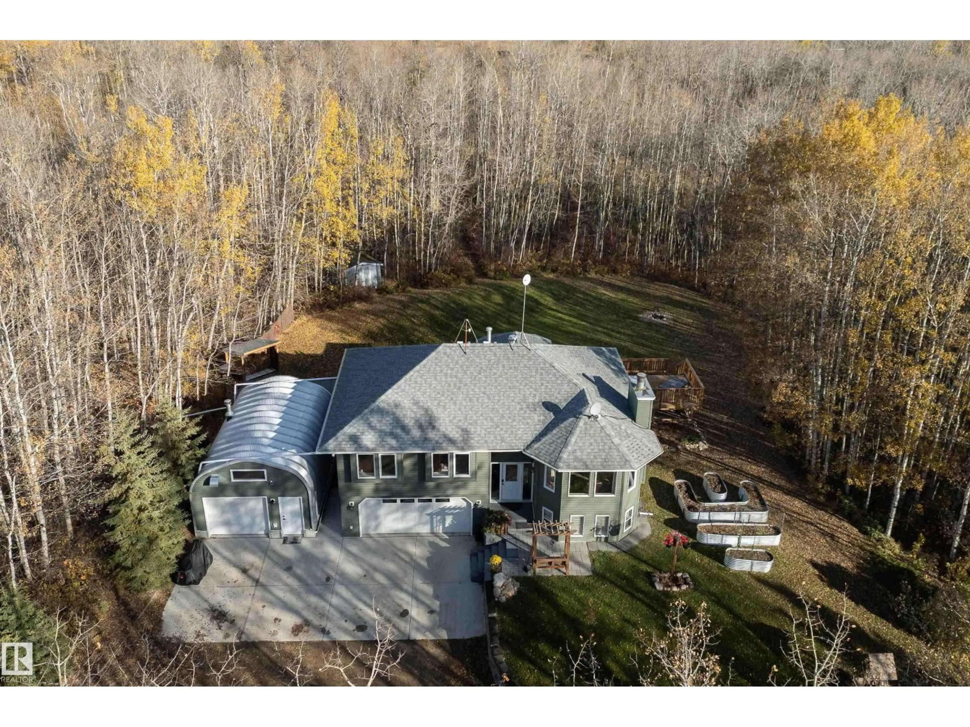 A pic from outside/outdoor area/front of a property/back of a property/a pic from drone, unknown for 330 50110 RGE RD, Rural Leduc County Alberta T0B3M3