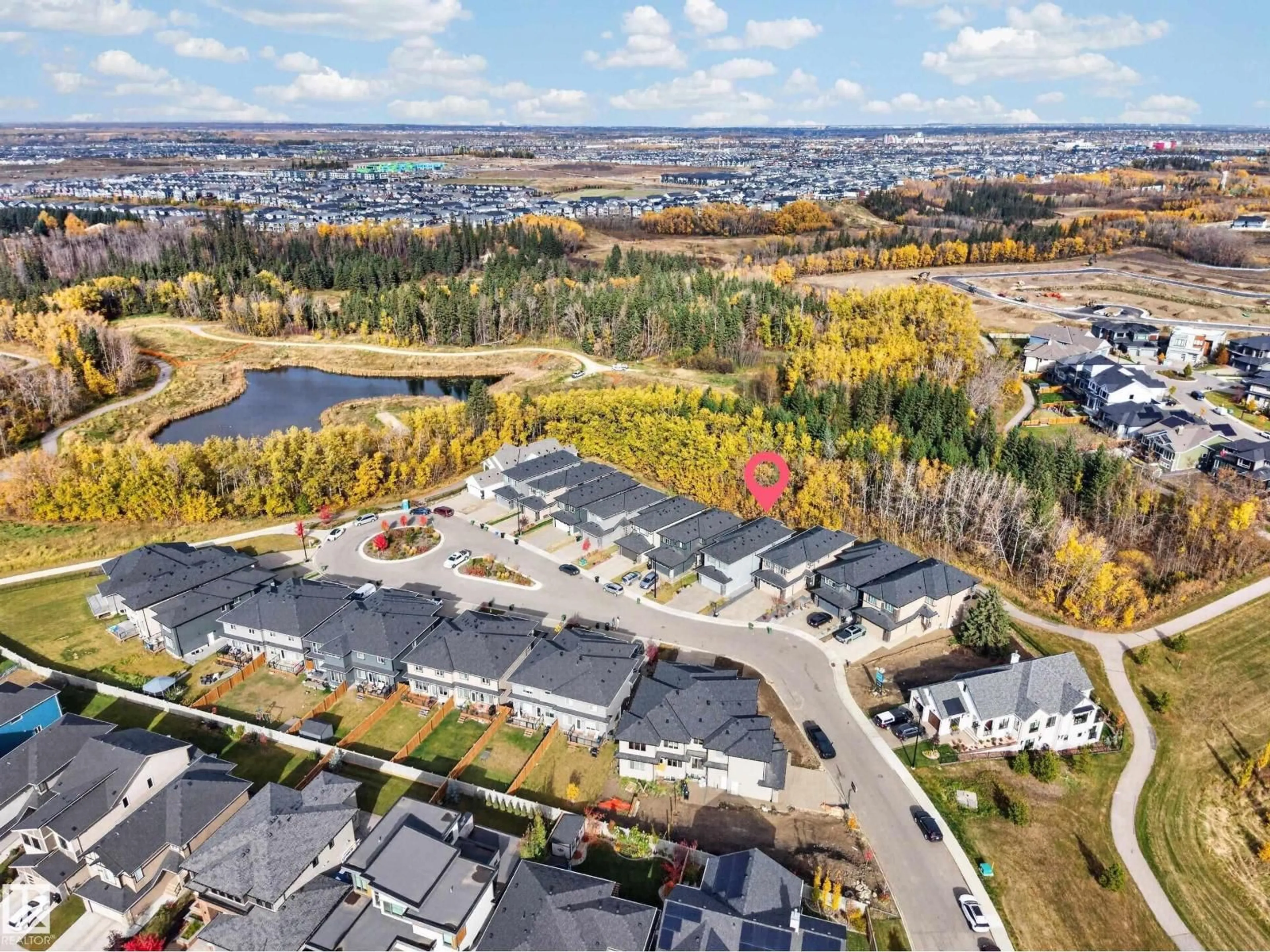 A pic from outside/outdoor area/front of a property/back of a property/a pic from drone, mountain view for 6626 CRAWFORD LANDING SW, Edmonton Alberta T6W4L5
