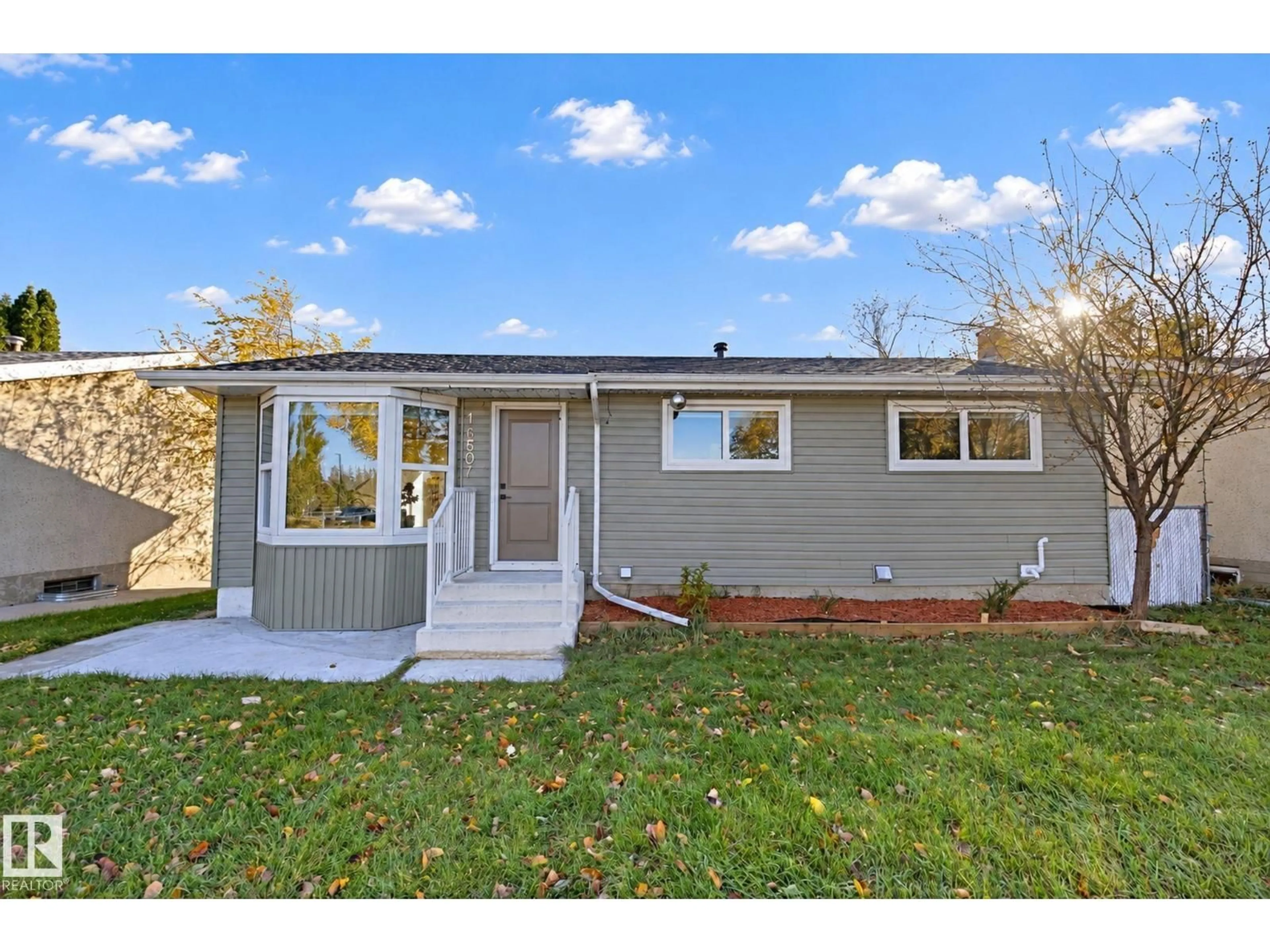 Home with vinyl exterior material, street for NW - 16507 91 AV, Edmonton Alberta T5R5A3