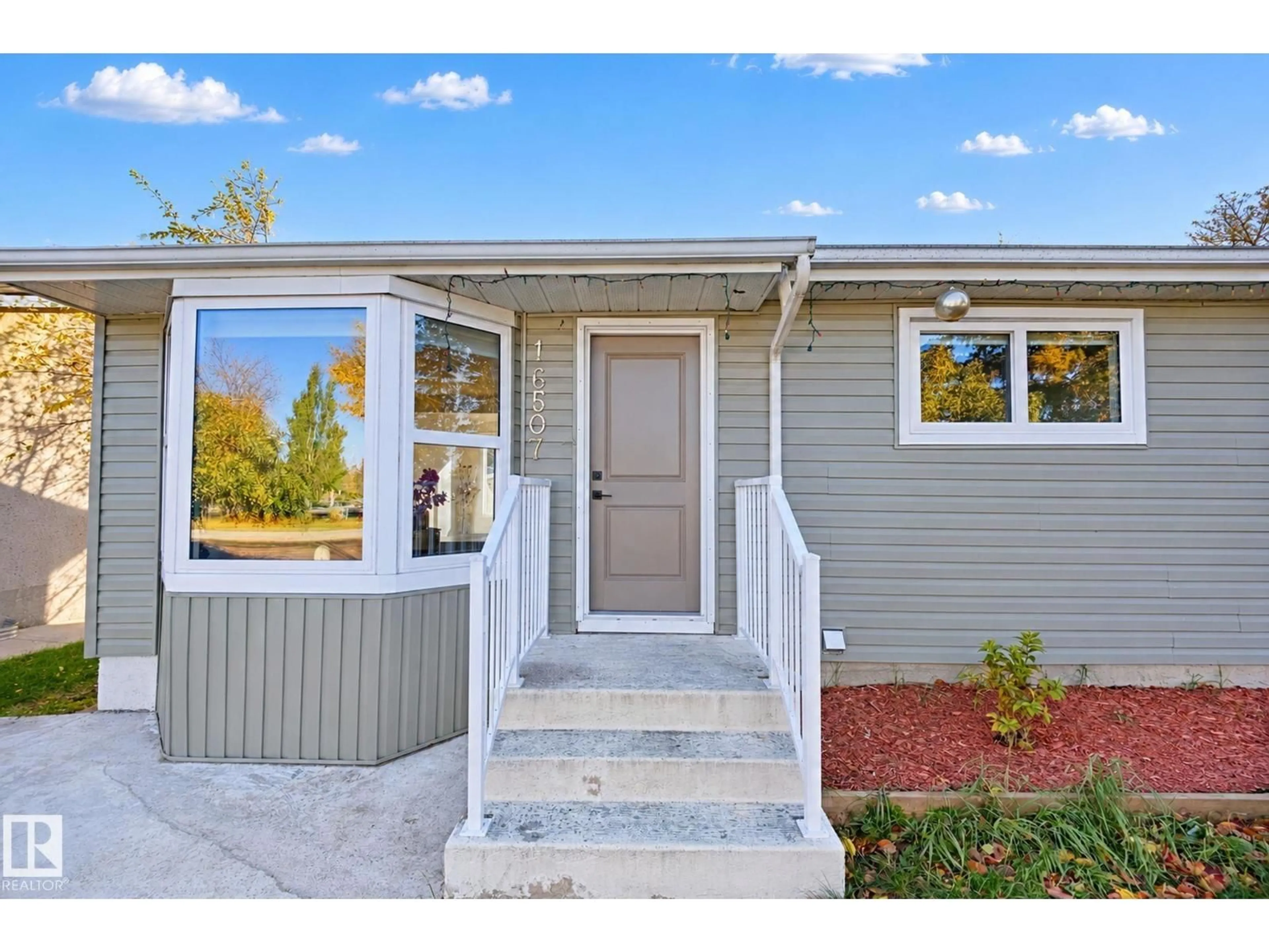 Home with vinyl exterior material, street for NW - 16507 91 AV, Edmonton Alberta T5R5A3