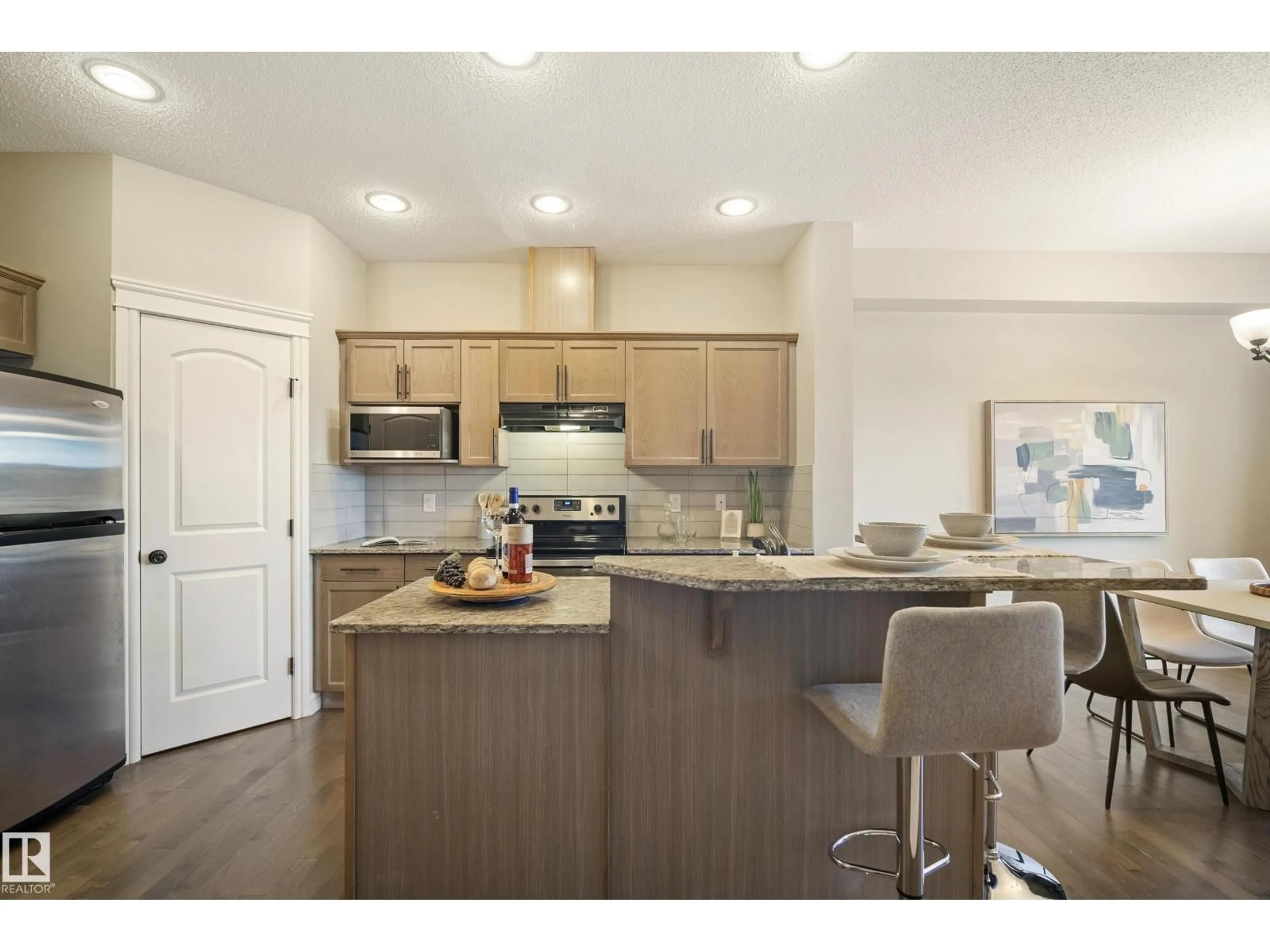 Open concept kitchen, wood/laminate floor for NW - 17011 38 ST, Edmonton Alberta T5Y3S2
