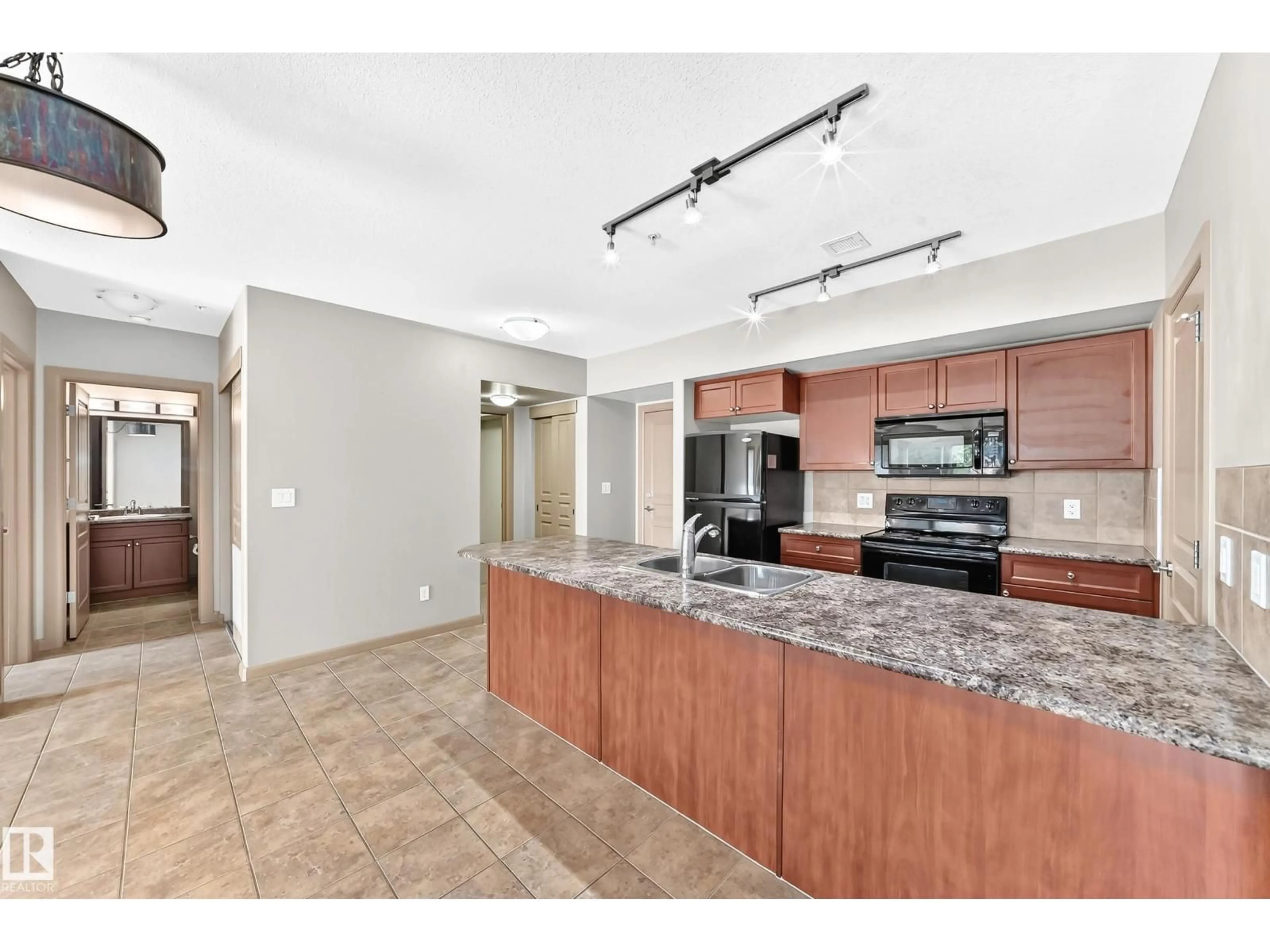 Open concept kitchen, ceramic/tile floor for 207 - 500 PALISADES WY, Sherwood Park Alberta T8H0H7
