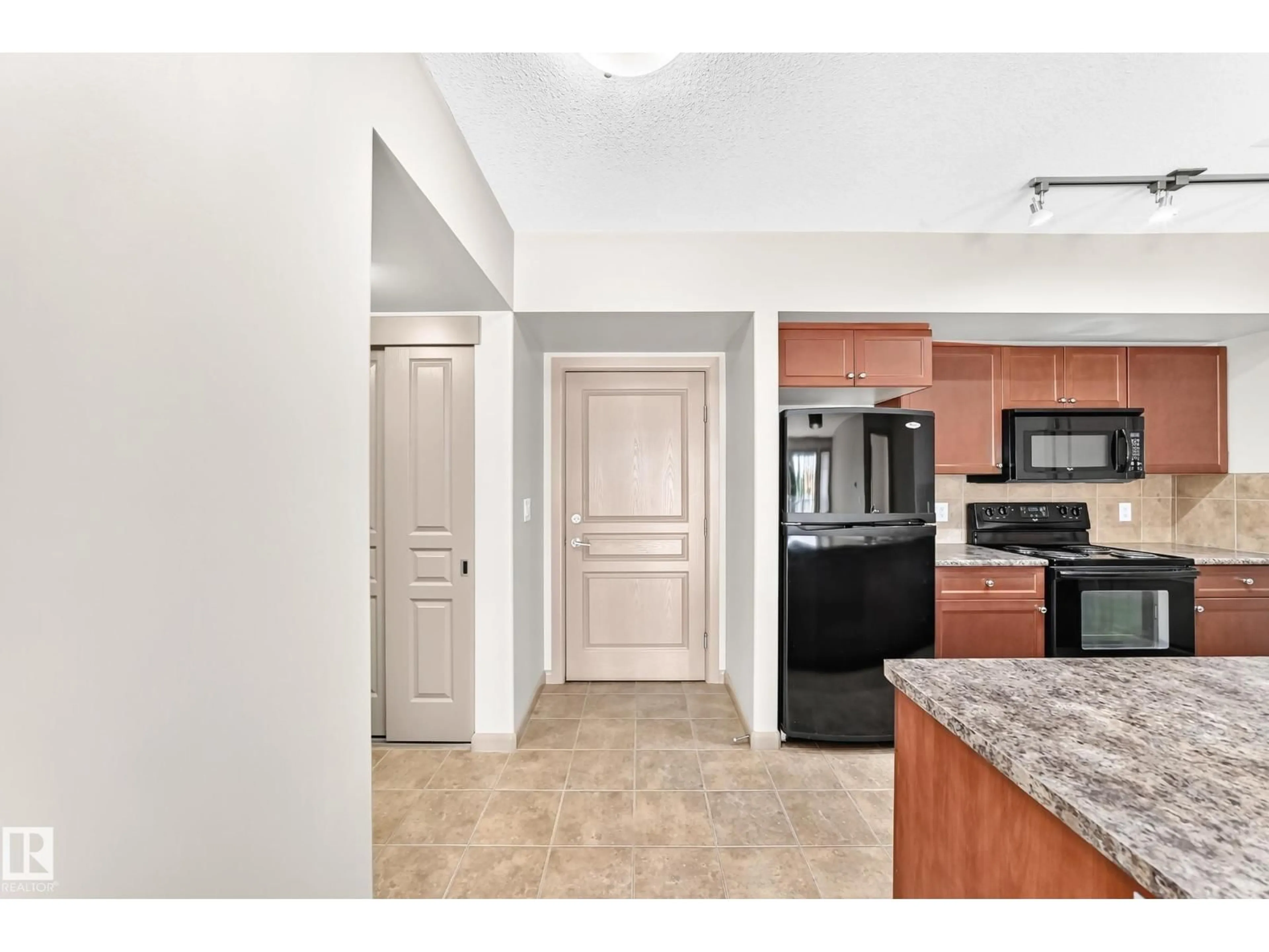 Open concept kitchen, ceramic/tile floor for 207 - 500 PALISADES WY, Sherwood Park Alberta T8H0H7