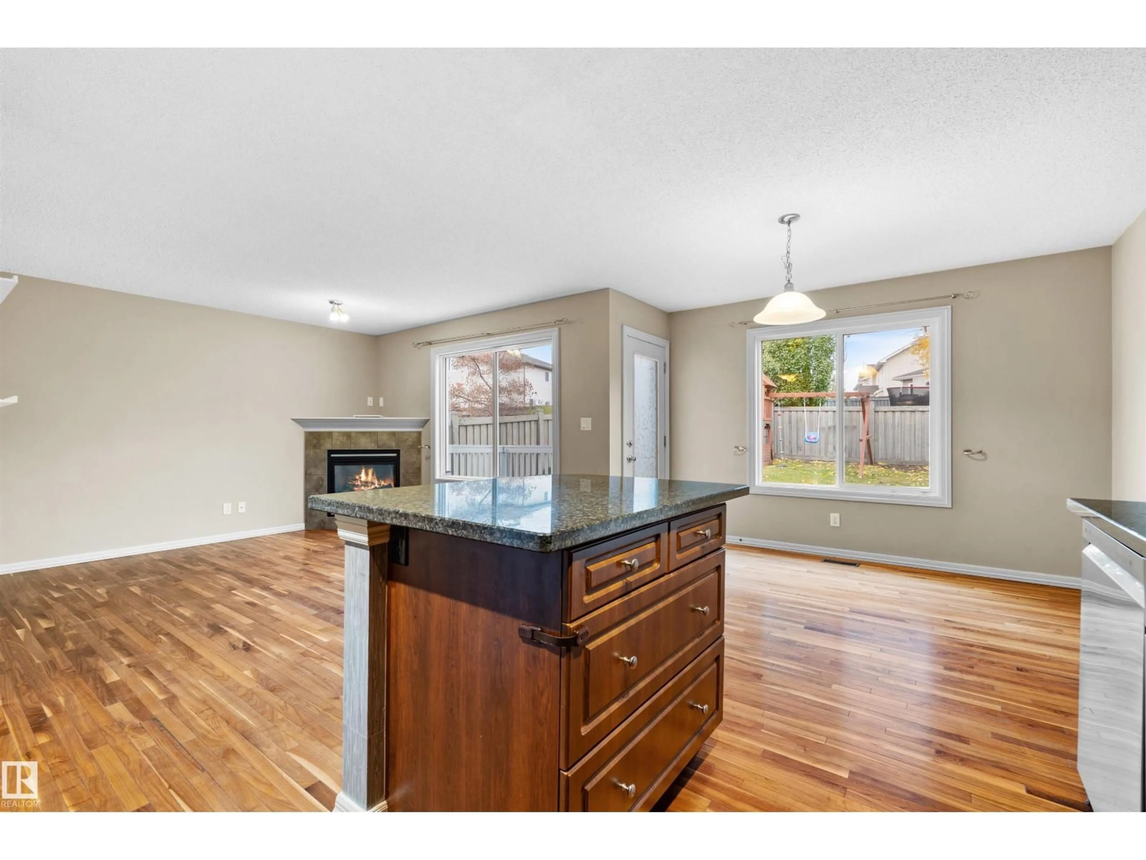 Open concept kitchen, wood/laminate floor for NW - 4816 213 ST, Edmonton Alberta T6M0G7