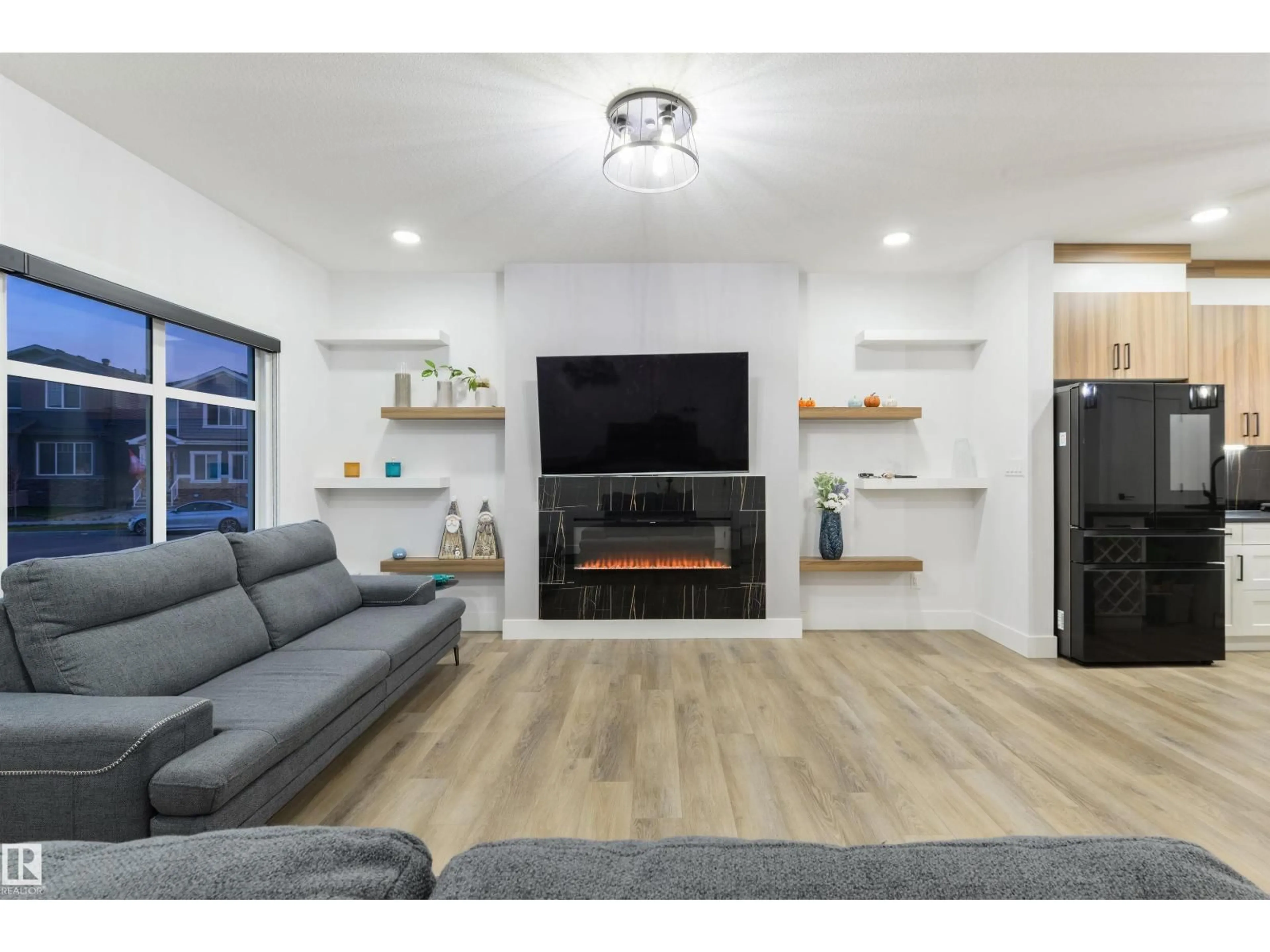 Living room with furniture, wood/laminate floor for 4373 37 ST, Beaumont Alberta T4X0C4