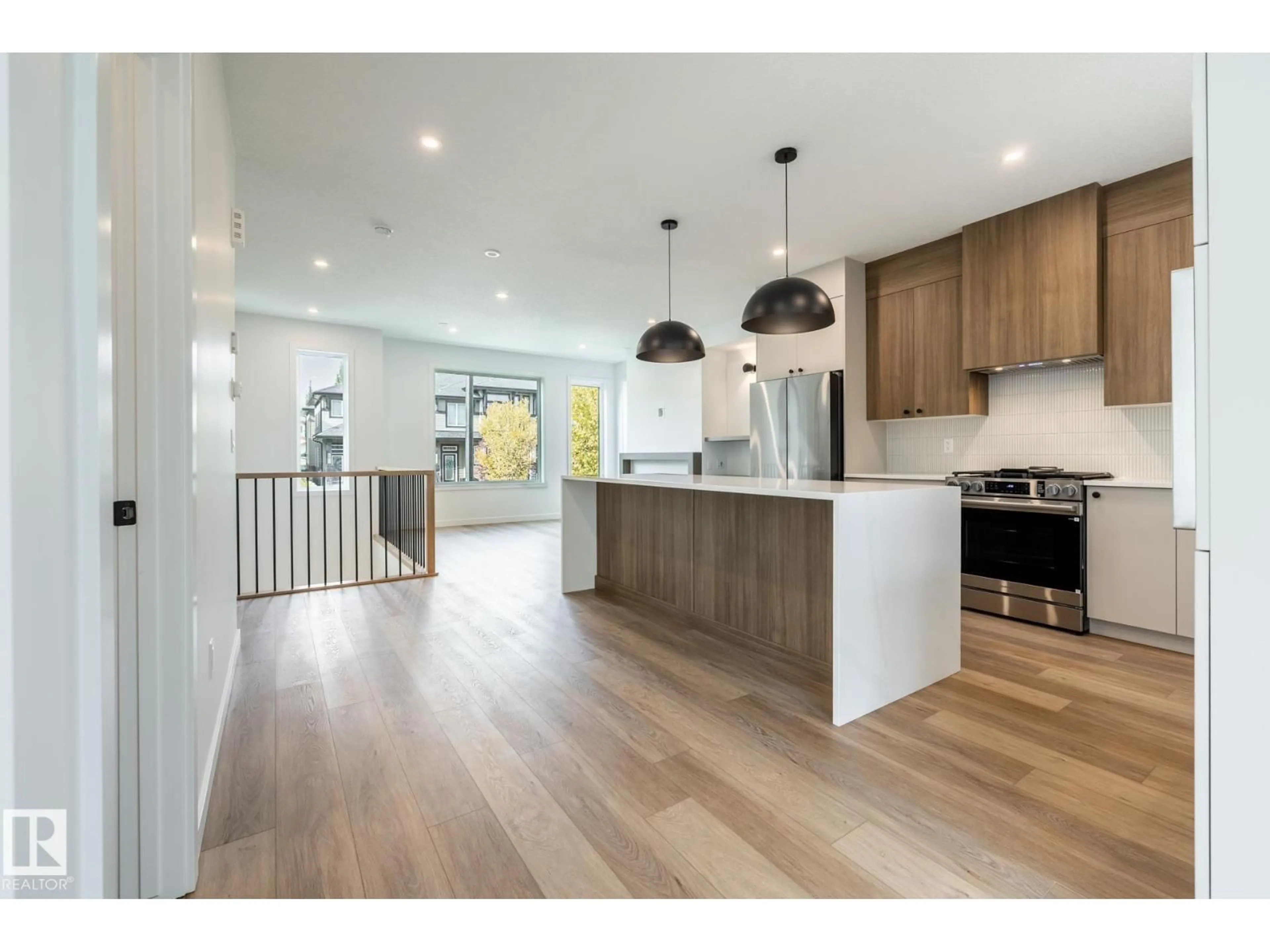 Open concept kitchen, wood/laminate floor for 7443 MAY COMMON, Edmonton Alberta T6R0X4