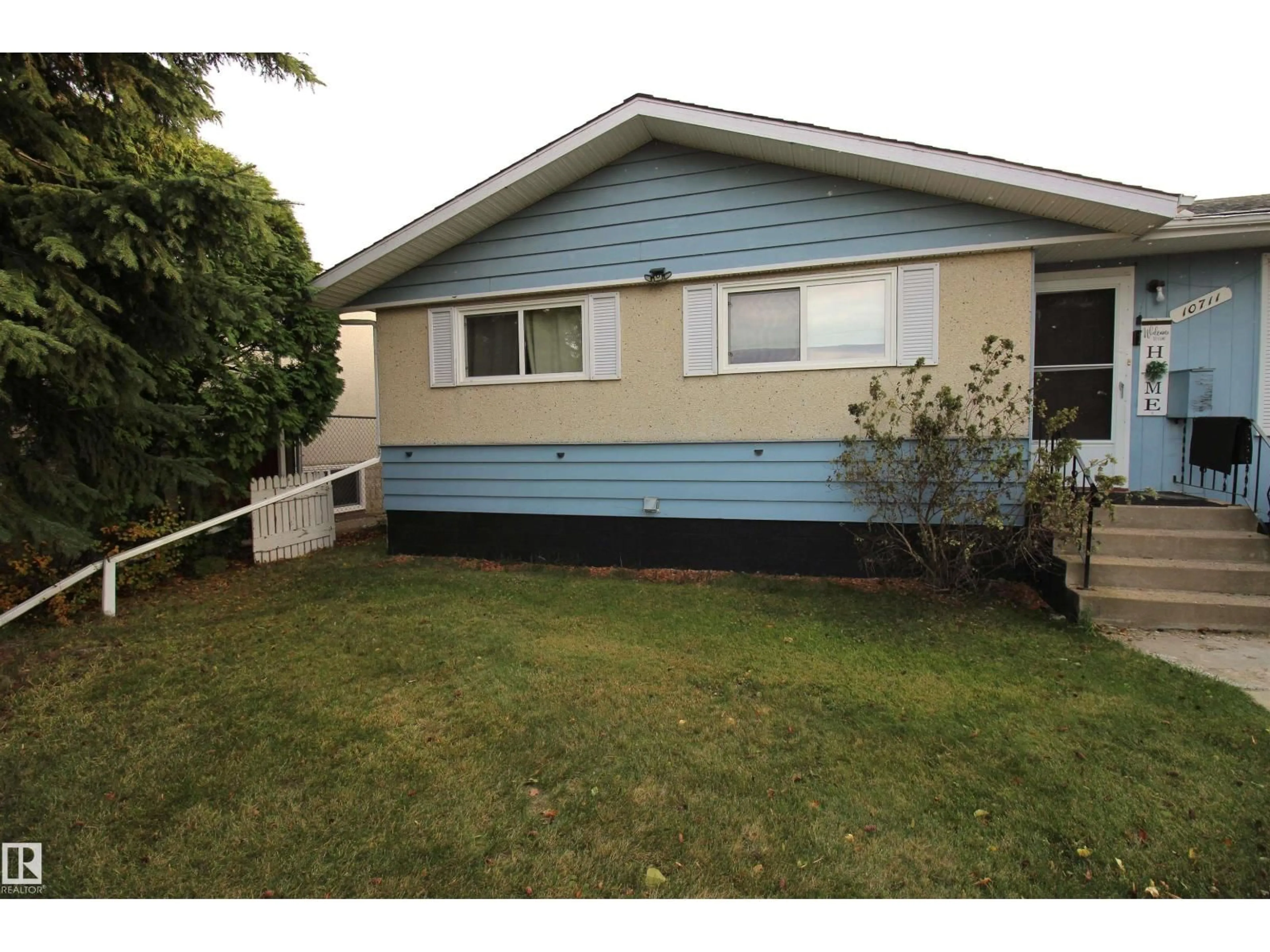 Home with vinyl exterior material, street for 10711 102 ST, Westlock Alberta T7P1H6