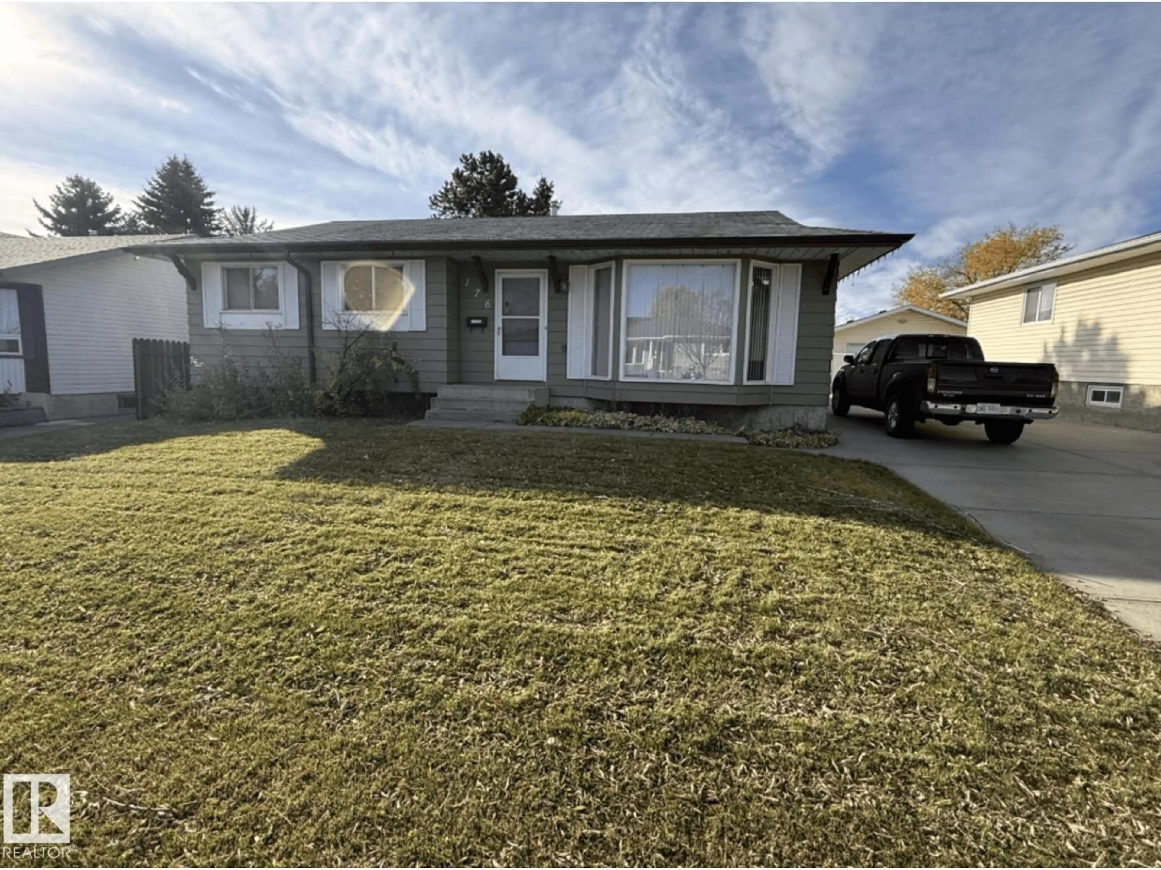 Home with vinyl exterior material, street for 176 HUMBERSTONE RD, Edmonton Alberta T5A4C6