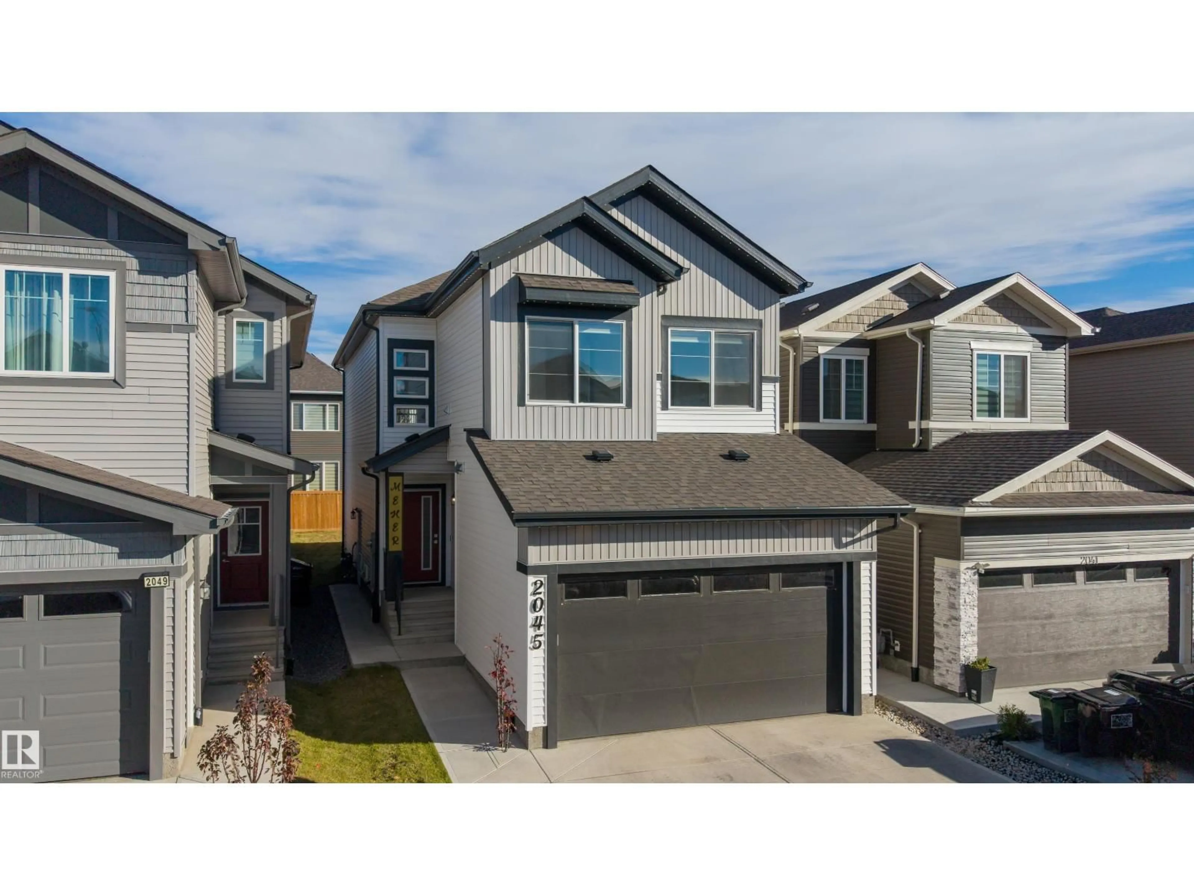 Home with vinyl exterior material, street for NW - 2045 209A ST, Edmonton Alberta T6M3C8