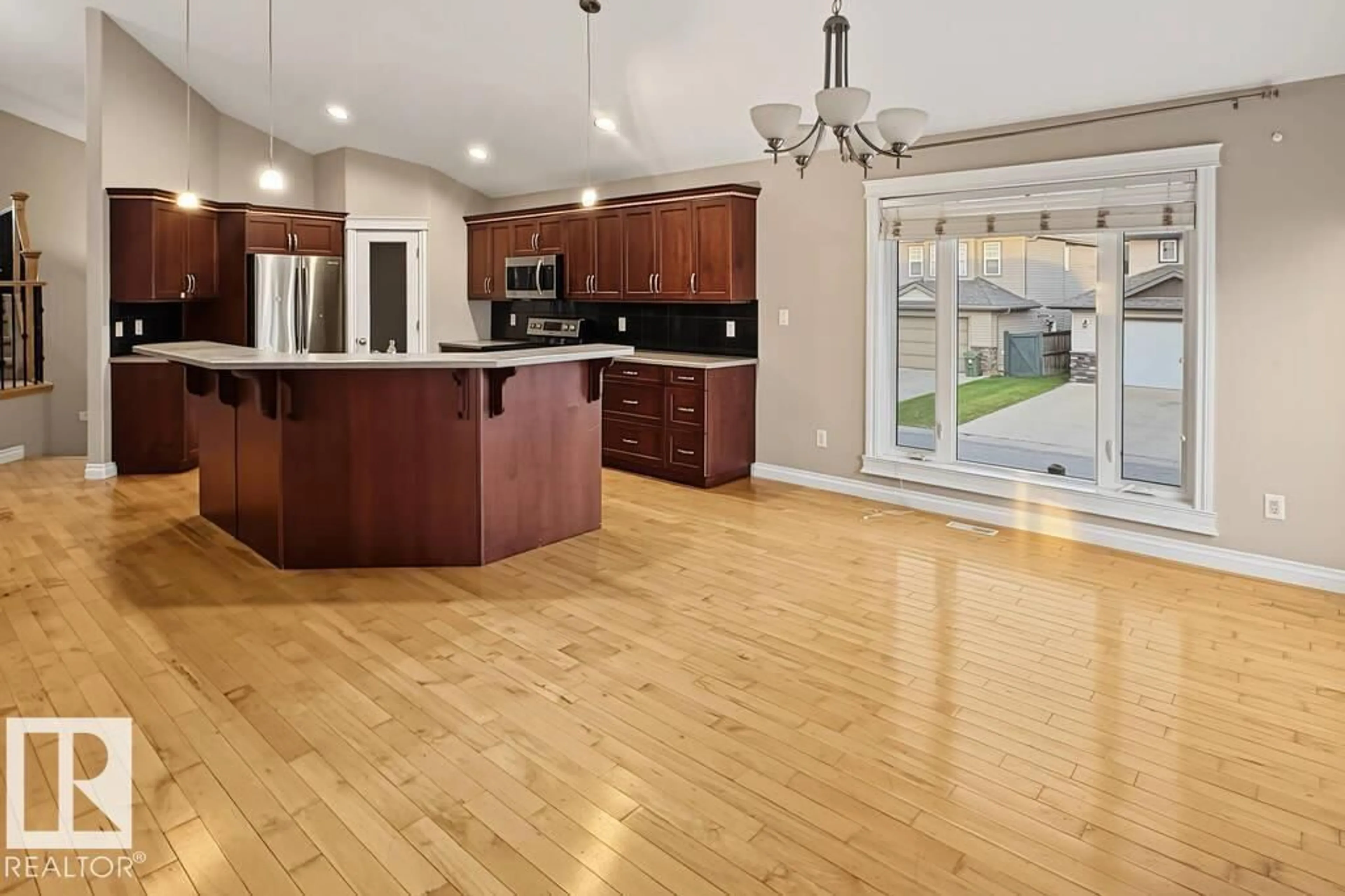 Open concept kitchen, wood/laminate floor for 3808 45 AV, Bonnyville Town Alberta T9N0A8