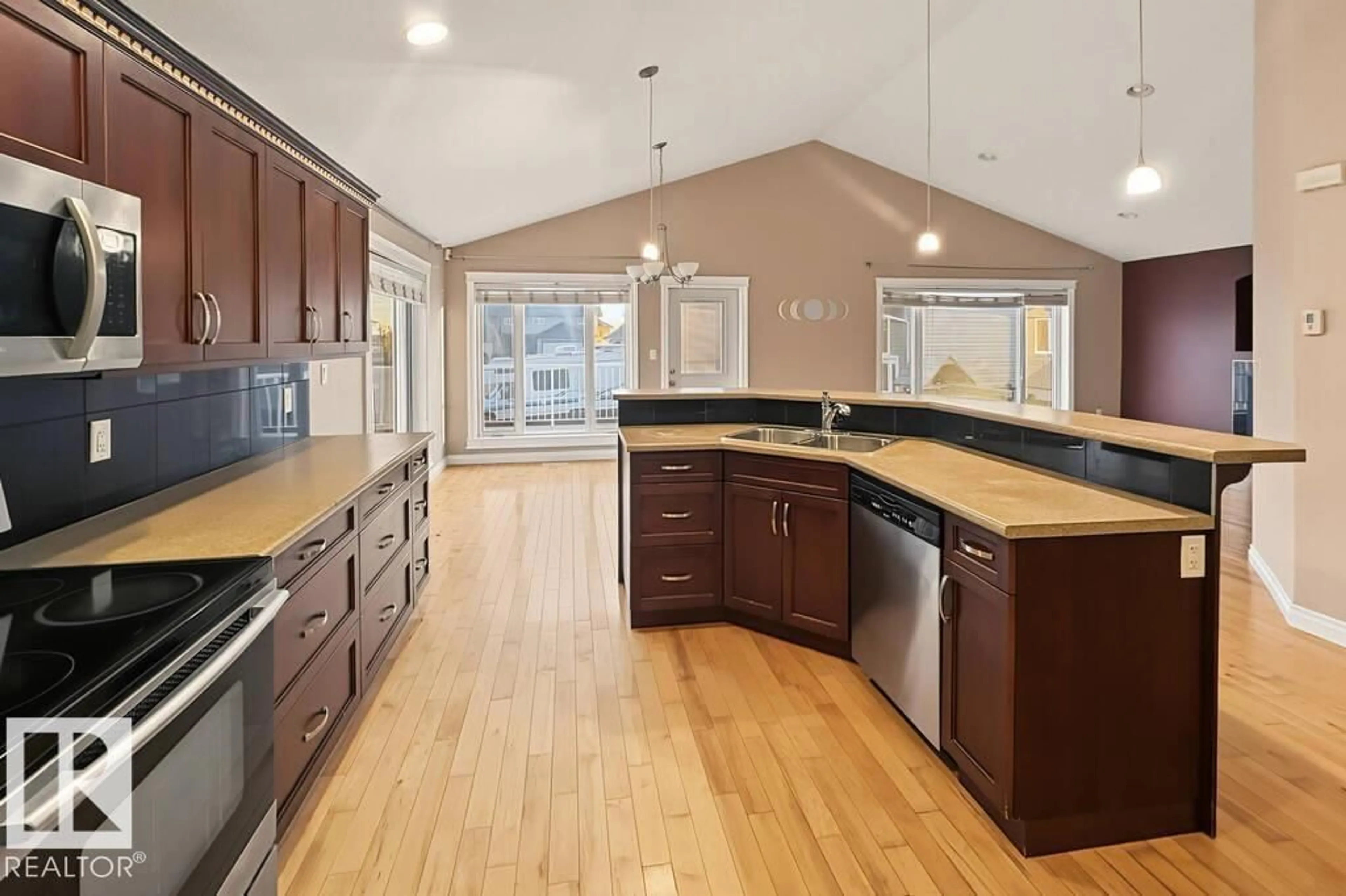 Open concept kitchen, wood/laminate floor for 3808 45 AV, Bonnyville Town Alberta T9N0A8