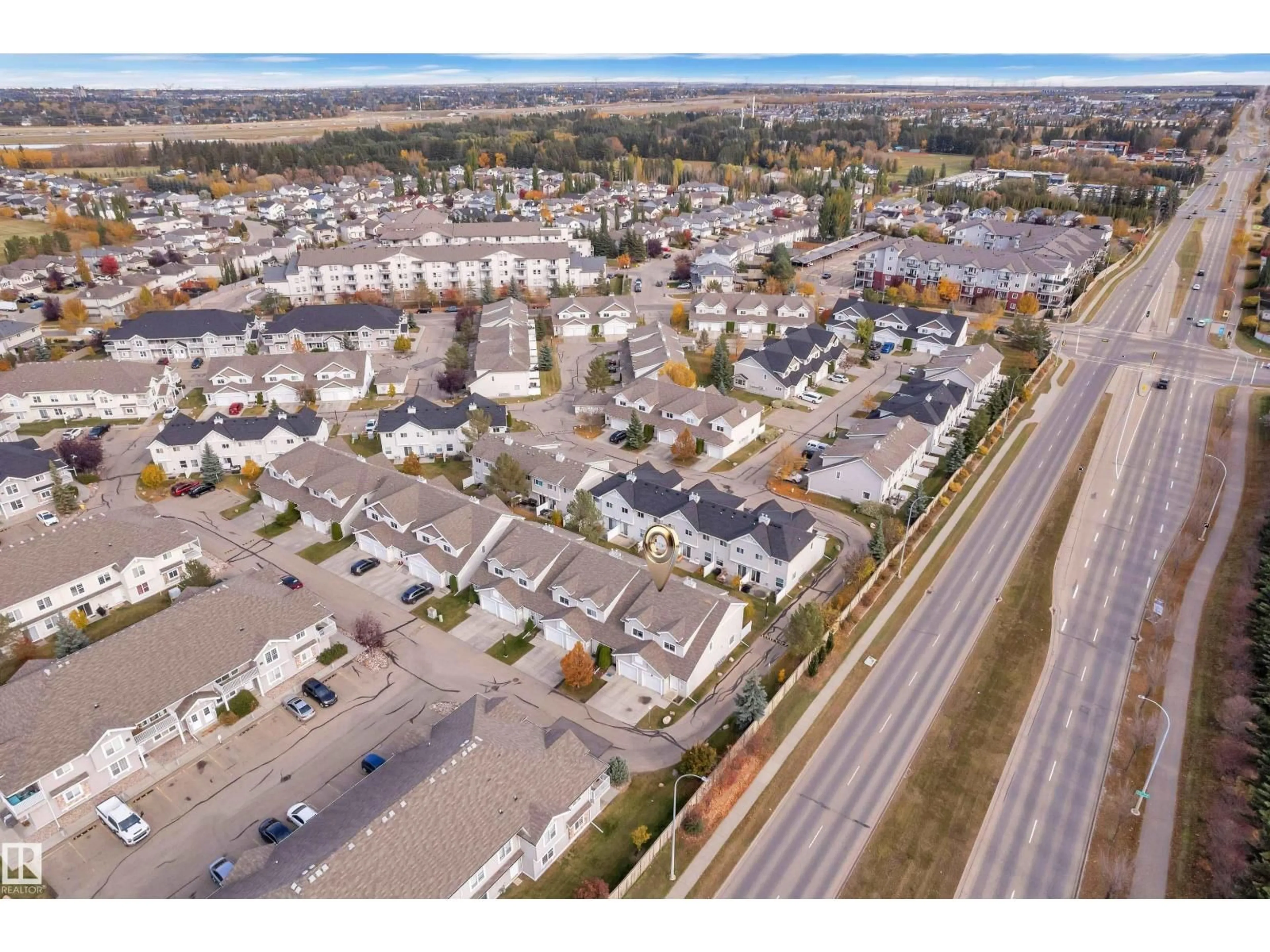 A pic from outside/outdoor area/front of a property/back of a property/a pic from drone, street for #100 - 150 EDWARDS DR, Edmonton Alberta T6X1M4