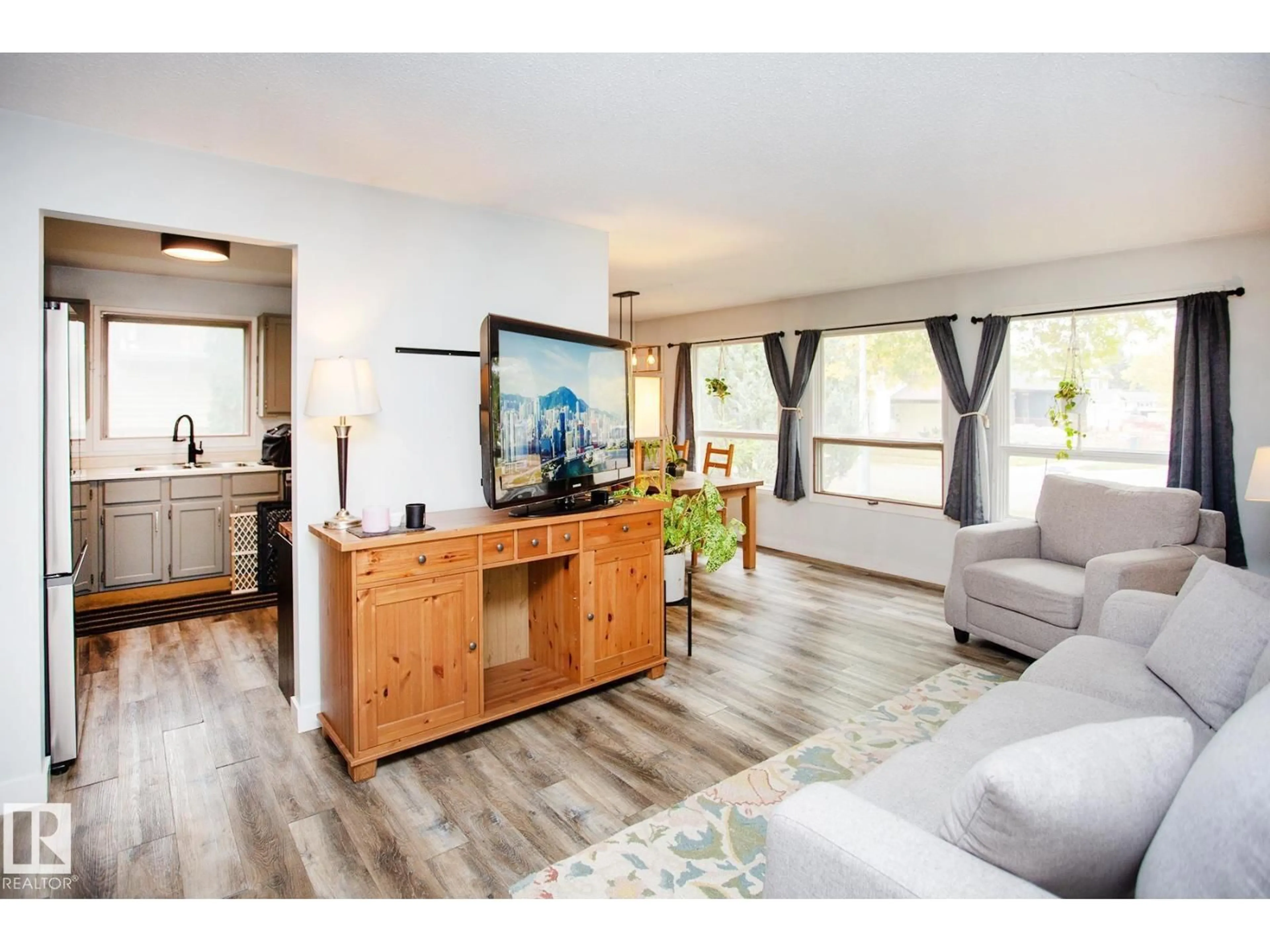 Living room with furniture, wood/laminate floor for 8 ASH CR, St. Albert Alberta T8N3J3