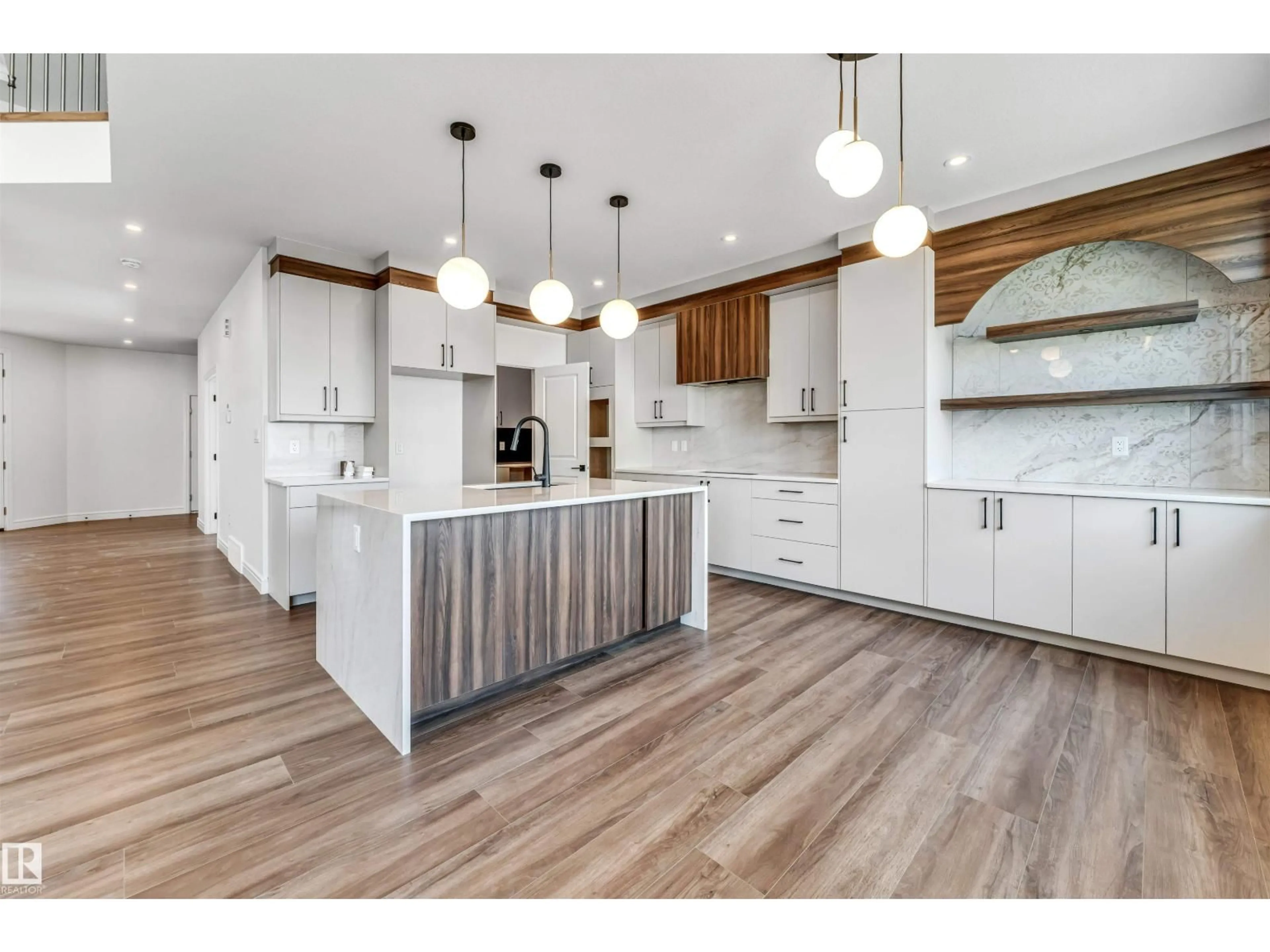 Open concept kitchen, wood/laminate floor for 19420 25 ST, Edmonton Alberta T6J7J7