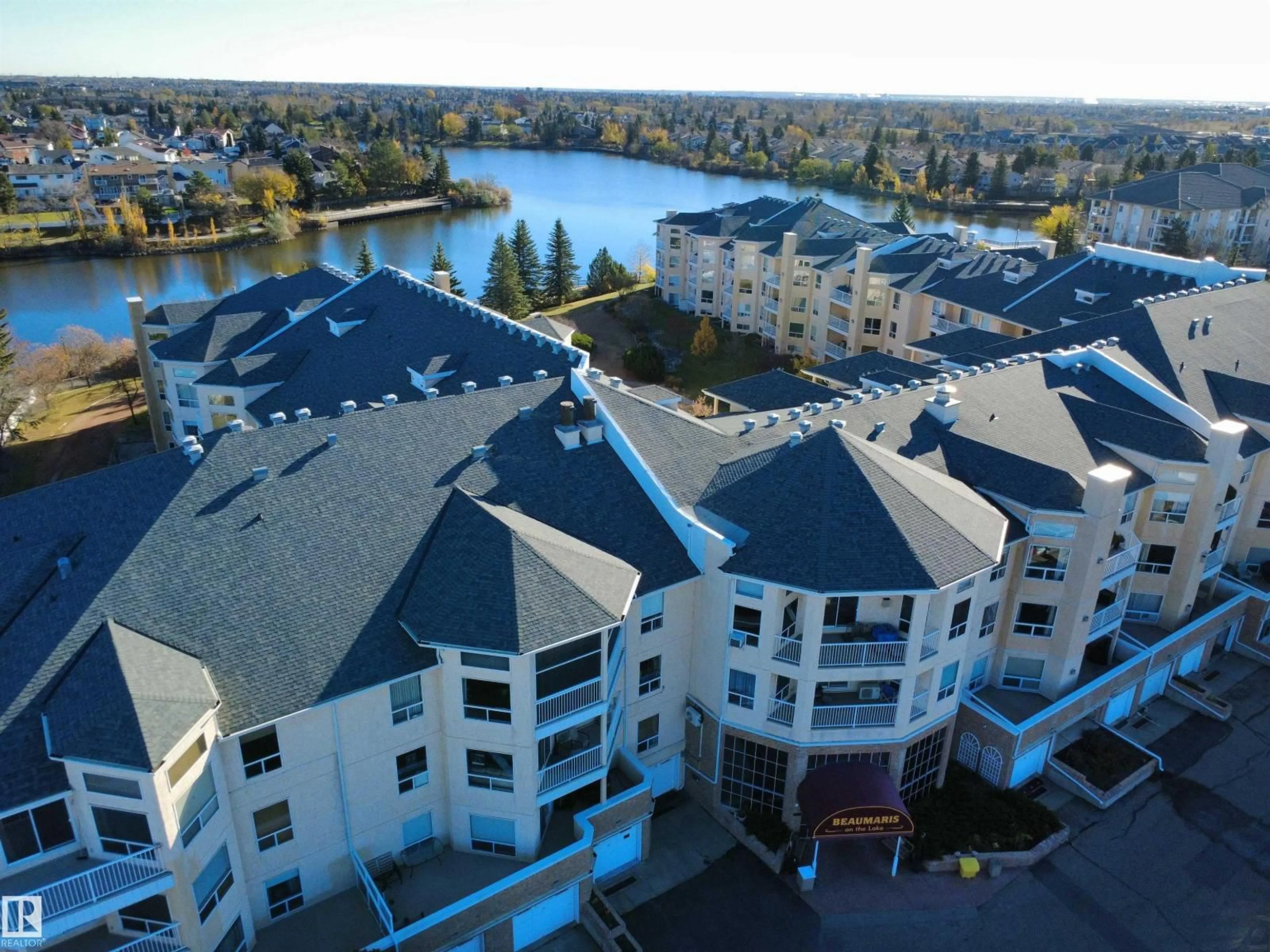 A pic from outside/outdoor area/front of a property/back of a property/a pic from drone, water/lake/river/ocean view for #419 - 15499 CASTLE DOWNS RD, Edmonton Alberta T5X5Y3