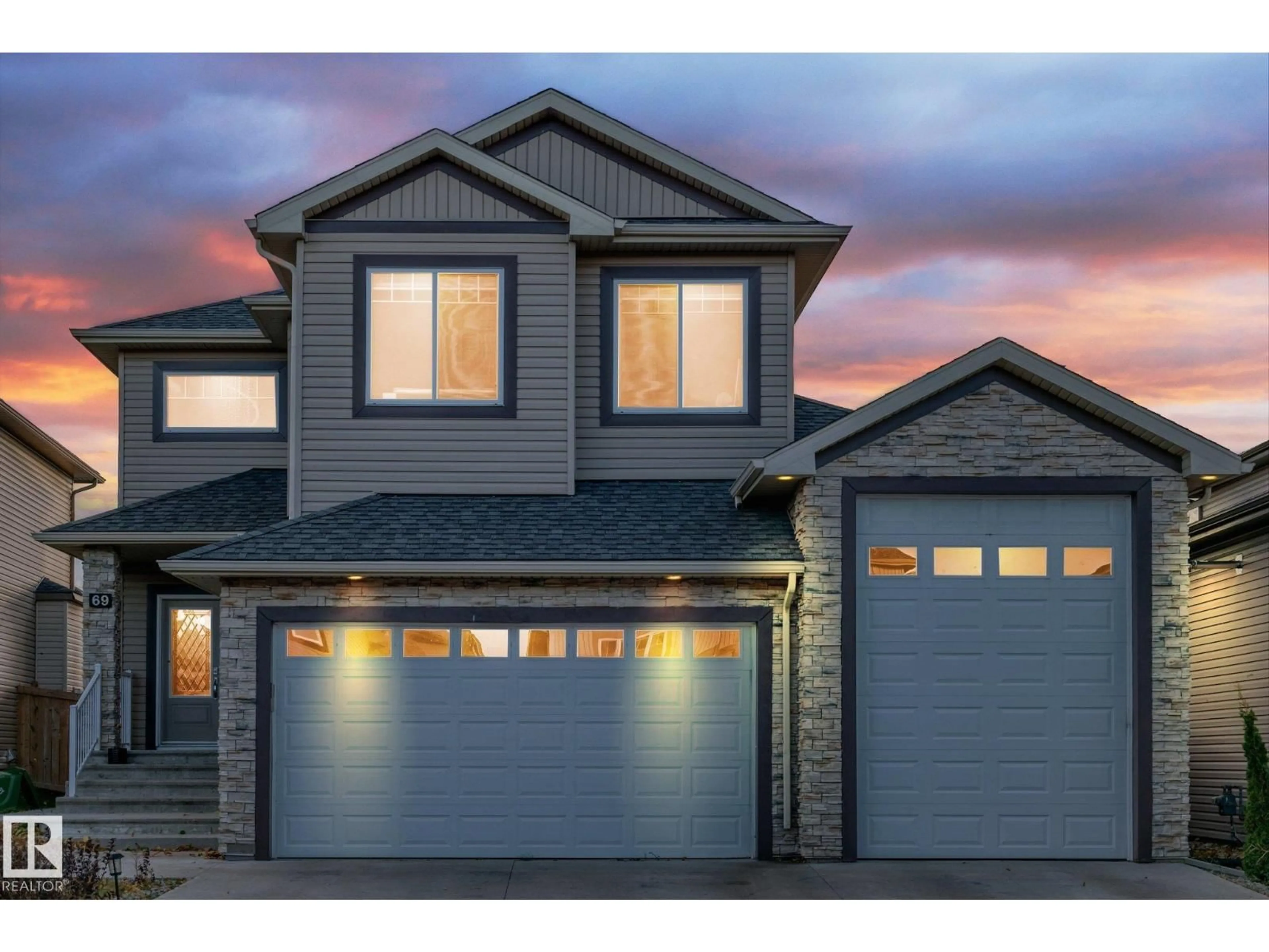 Home with vinyl exterior material, street for 69 CARAGANA WY, Fort Saskatchewan Alberta T8L0H4