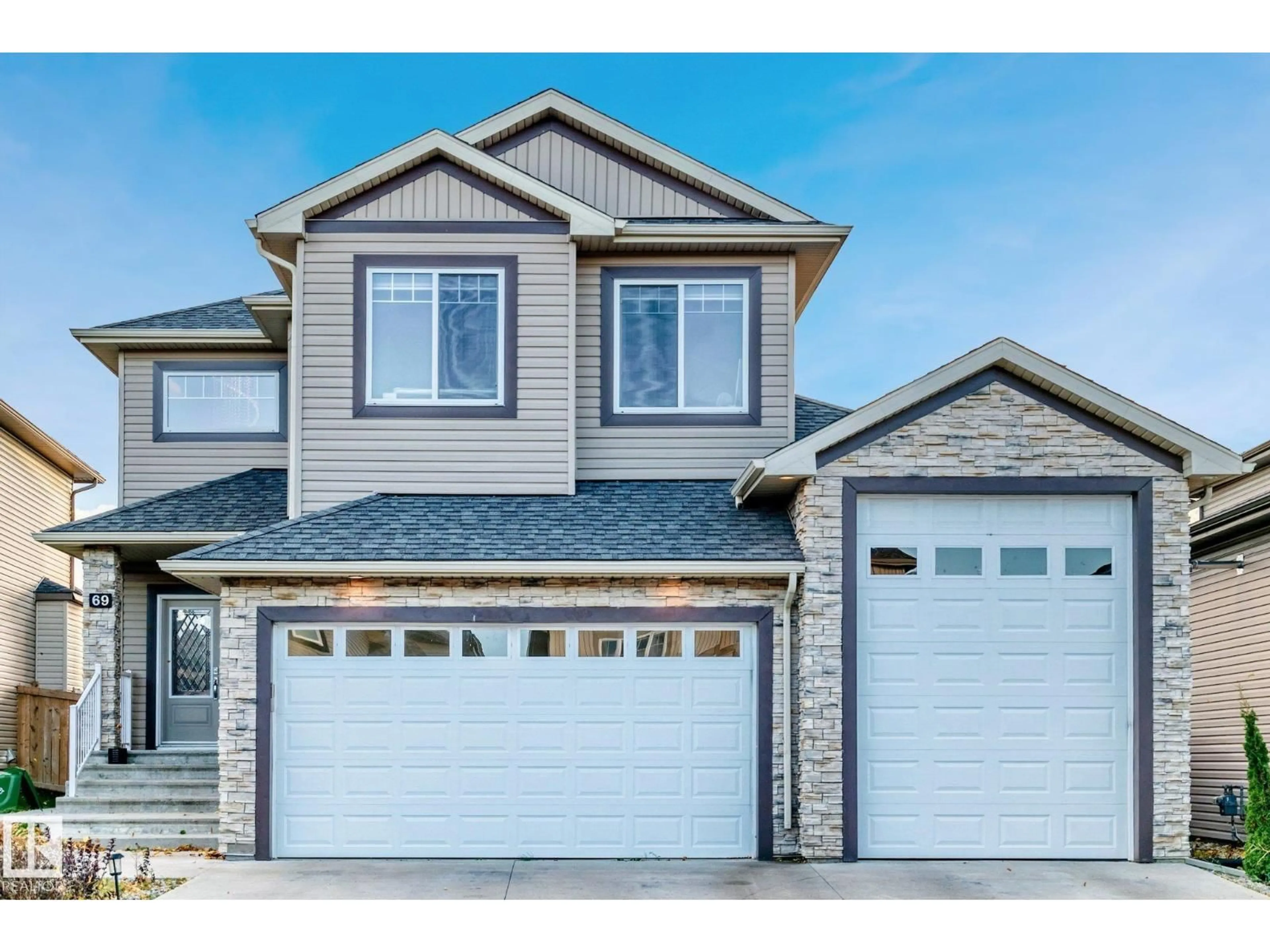 Home with vinyl exterior material, street for 69 CARAGANA WY, Fort Saskatchewan Alberta T8L0H4