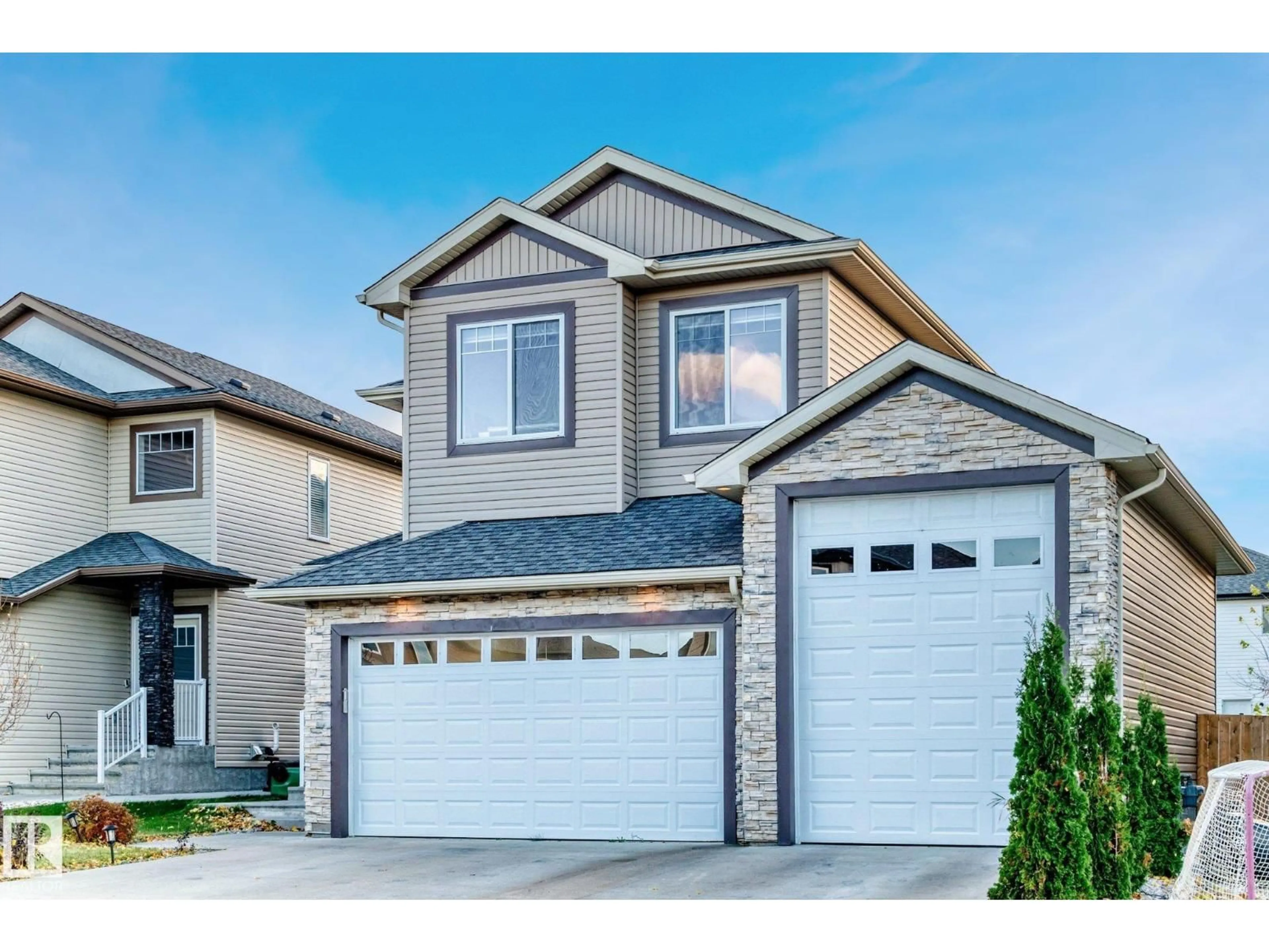 Home with vinyl exterior material, street for 69 CARAGANA WY, Fort Saskatchewan Alberta T8L0H4