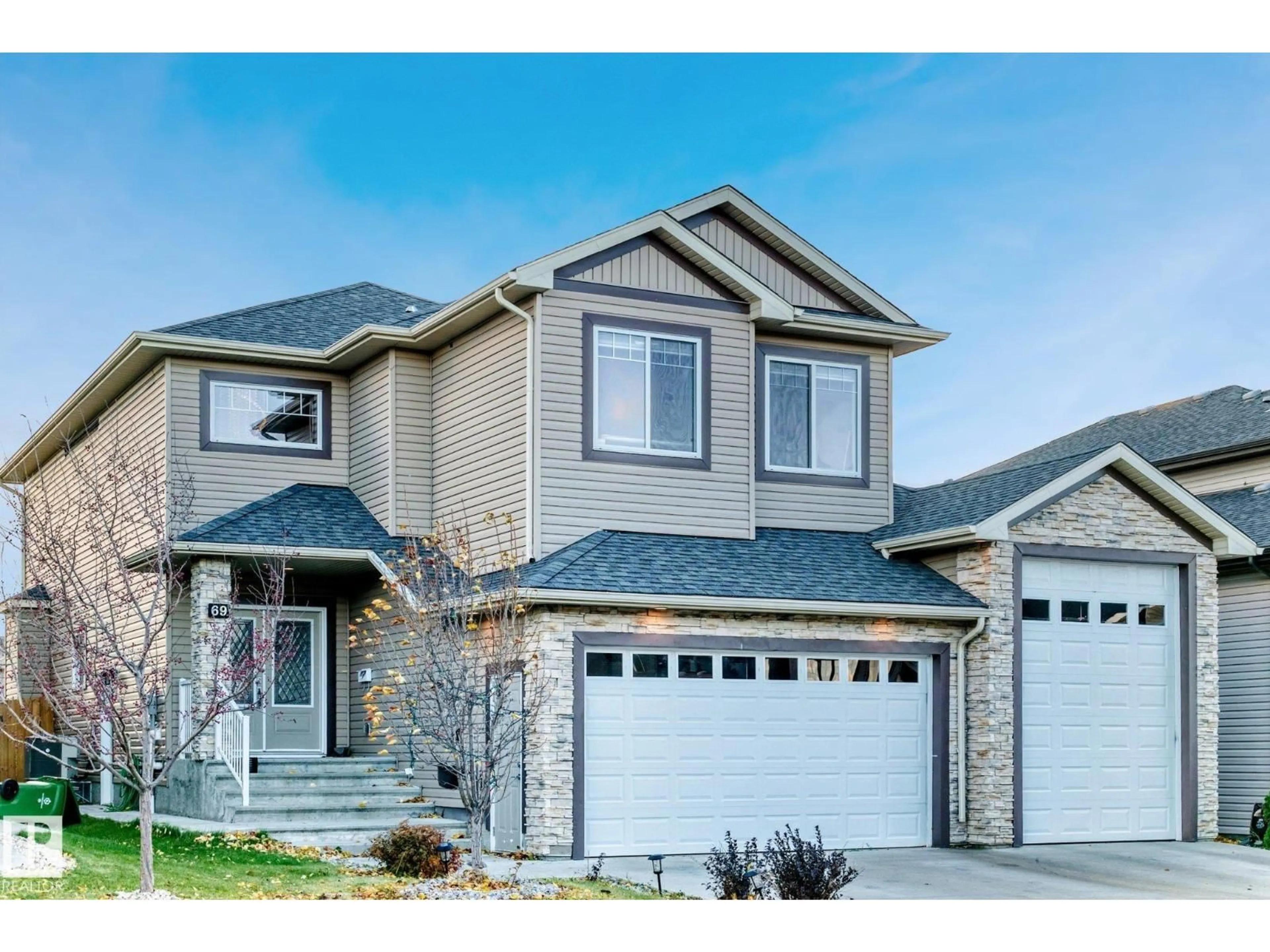 Home with vinyl exterior material, street for 69 CARAGANA WY, Fort Saskatchewan Alberta T8L0H4