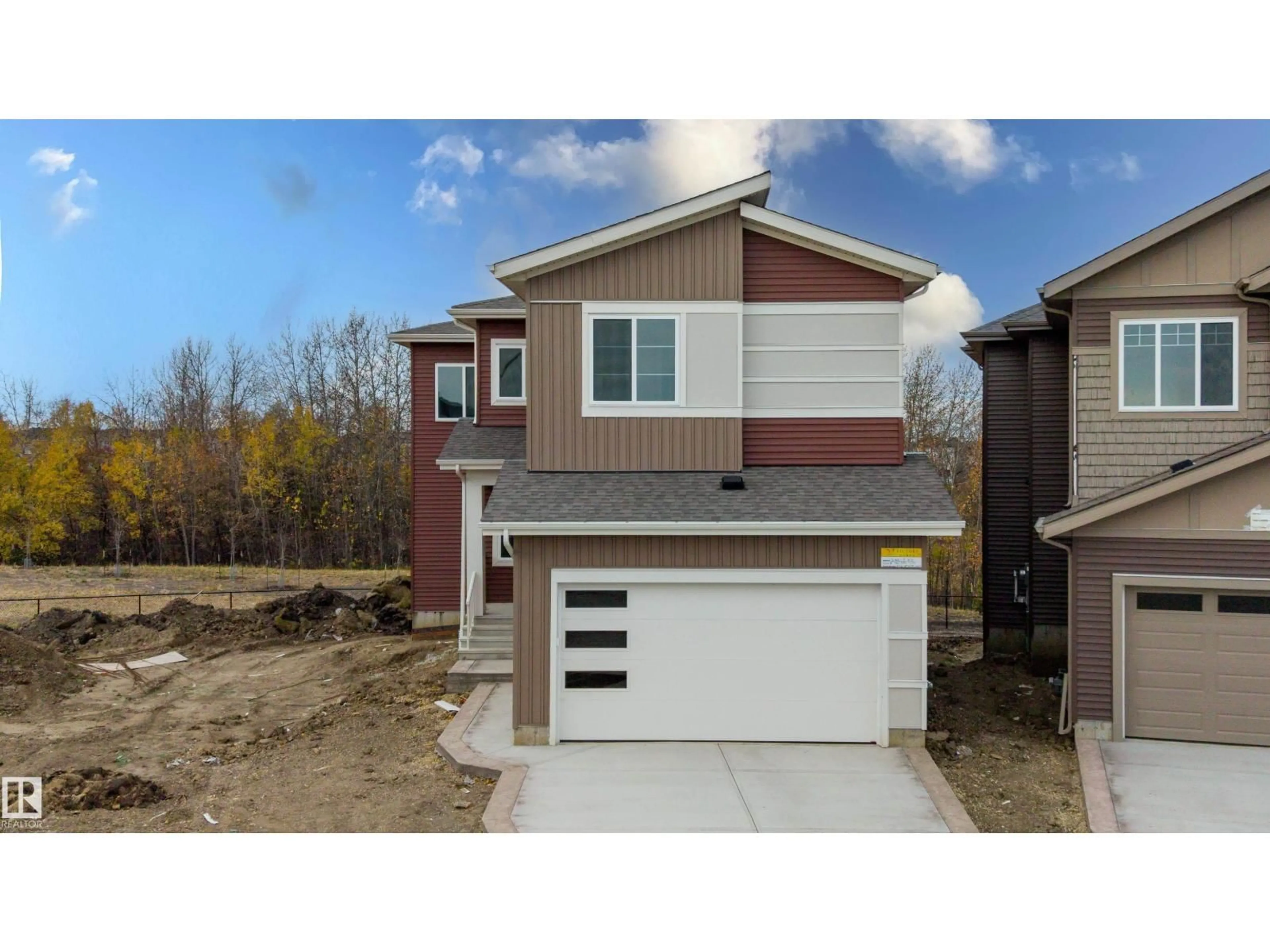 Home with vinyl exterior material, street for 2155 1 AV SW, Edmonton Alberta T6X3P6