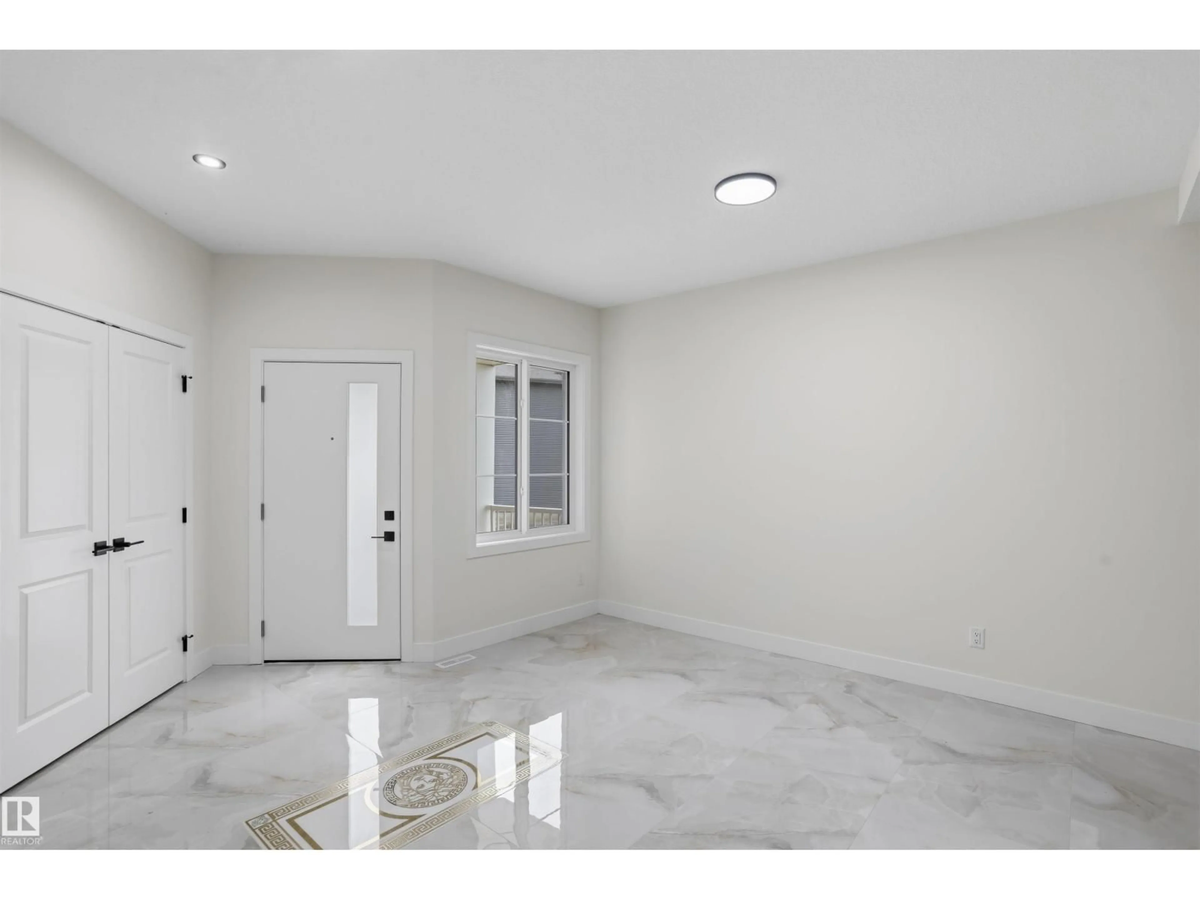 Indoor entryway for 2155 1 AV SW, Edmonton Alberta T6X3P6
